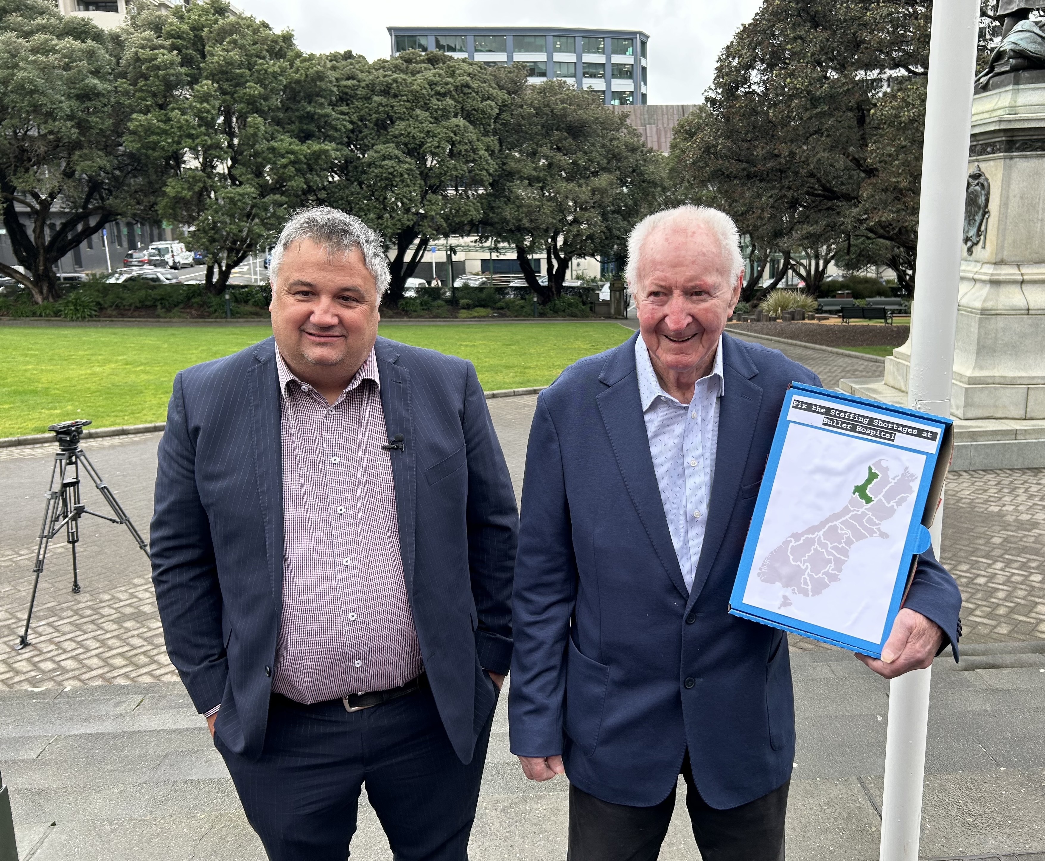 Patient Voice Aotearoa chairman Malcolm Mulholland (left) and his father George deliver a petition at Parliament earlier this month urging MPs to act to address the 'dire' state of Buller healthcare. Photo / Adam Pearse