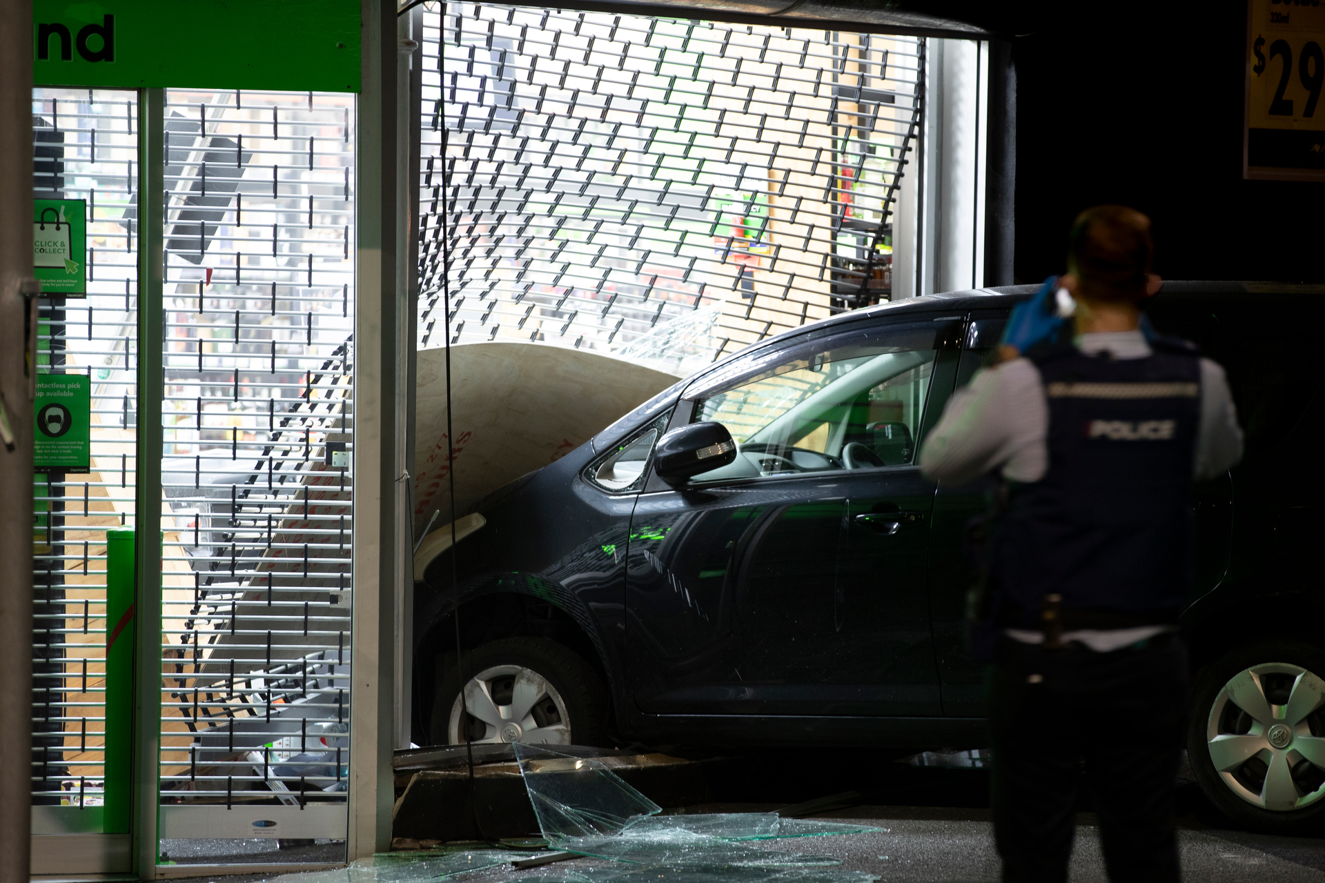 A Mount Eden liquor store was damaged during a ram raid. Photo / Hayden Woodward
