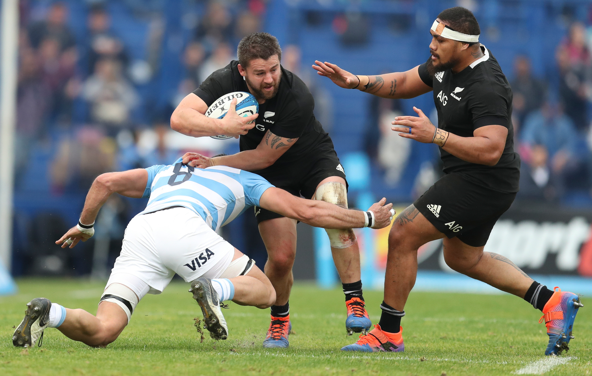 New Zealand's All Blacks Dane Coles, center, is tackled by Argentina's Los Pumas Javier Ortega Desio during a rugby championship match in Buenos Aires. Photo / AP