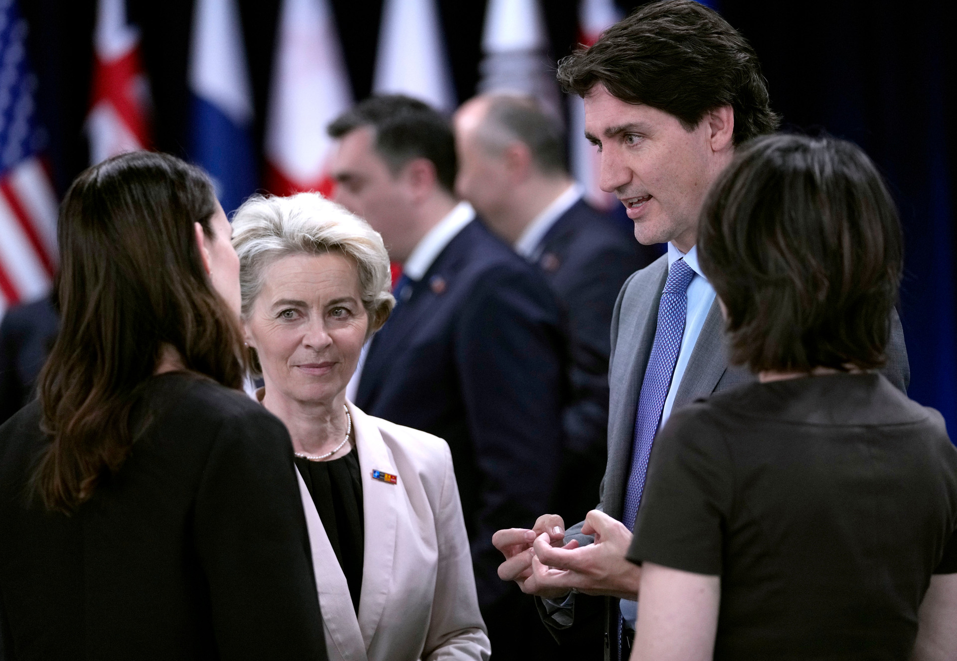 Prime Minister Jacinda Ardern speaks with European Commission President Ursula von der Leyen, Canadian Prime Minister Justin Trudeau and German Foreign Minister Annalena Baerbock. Photo / AP