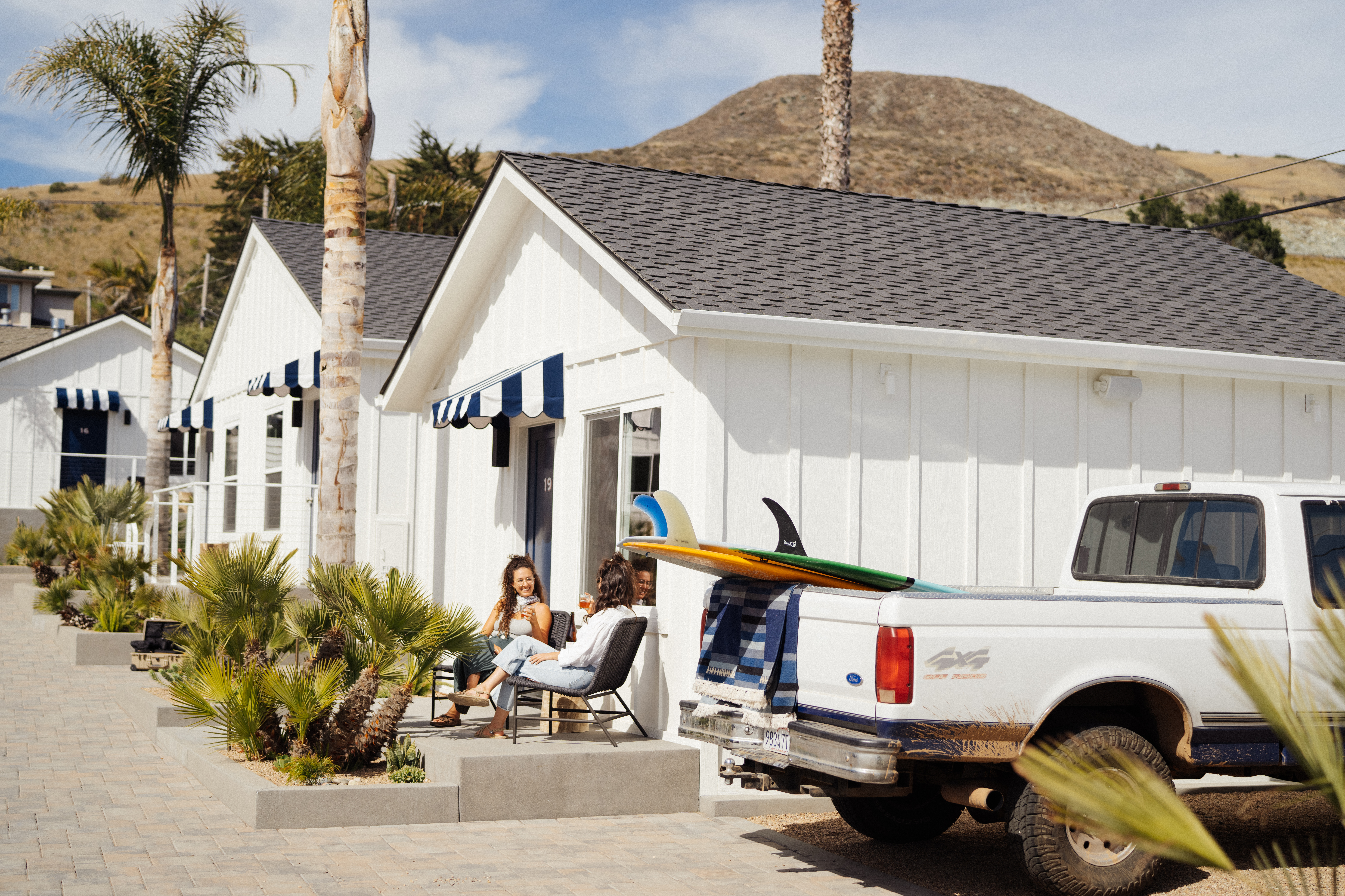 The Pacific Motel in Cayucos, recently refurbished into a chic boutique motel, offers modern minimalist rooms and fun amenities like outdoor fire pits, ensuring a stylish and comfortable stay by the California coast.