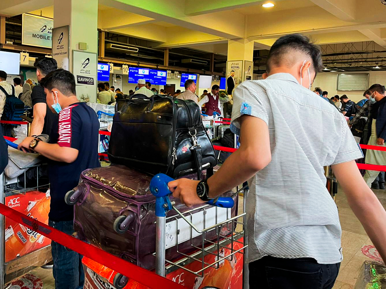 Passengers trying to fly out of Kabul International Airport amid the Taliban offensive. Photo / AP