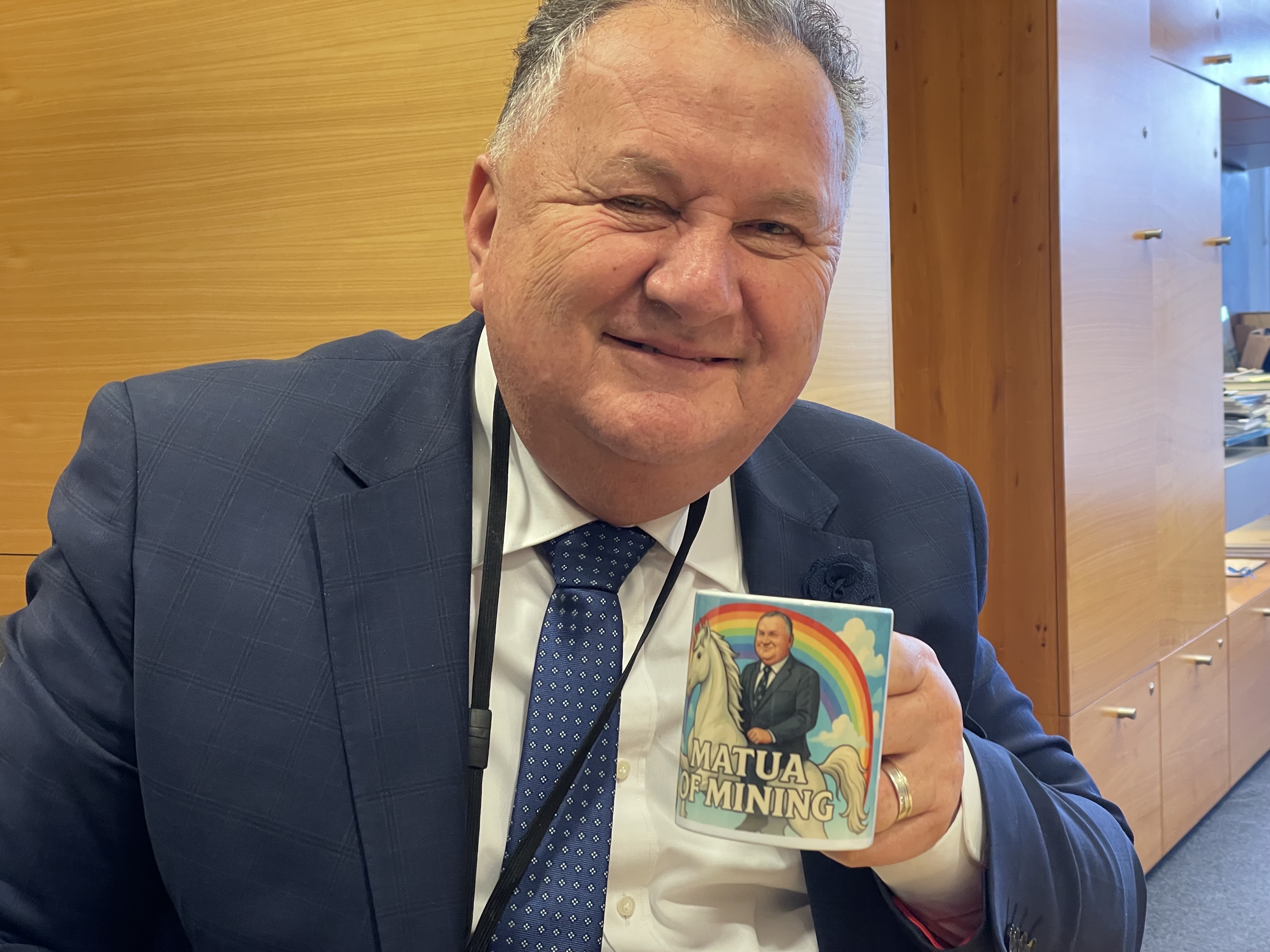 Minister Shane Jones with a mug reading 