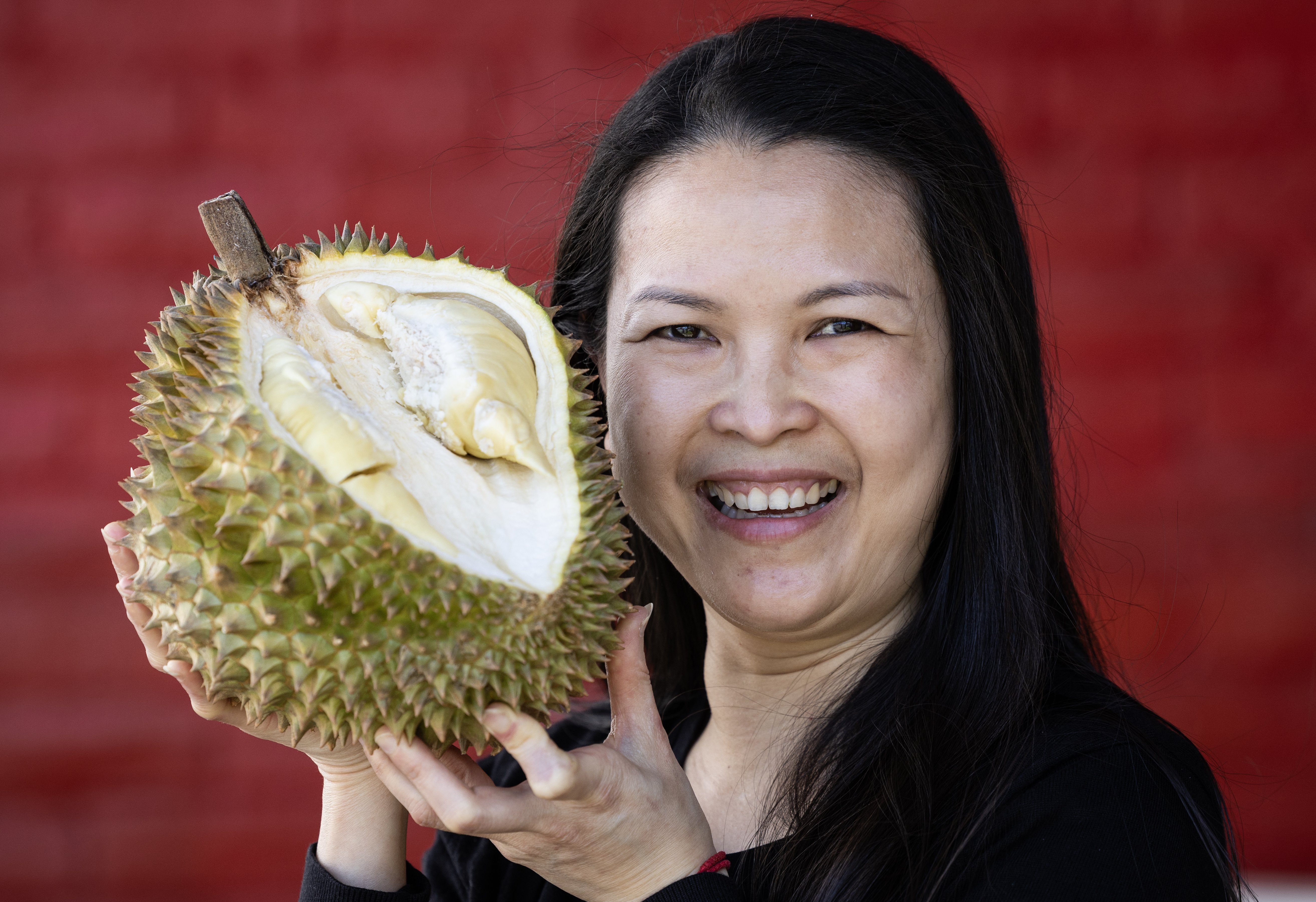 Le Musang owner Crystal Ng holds a durian. Photo / Jason Oxenham.�
