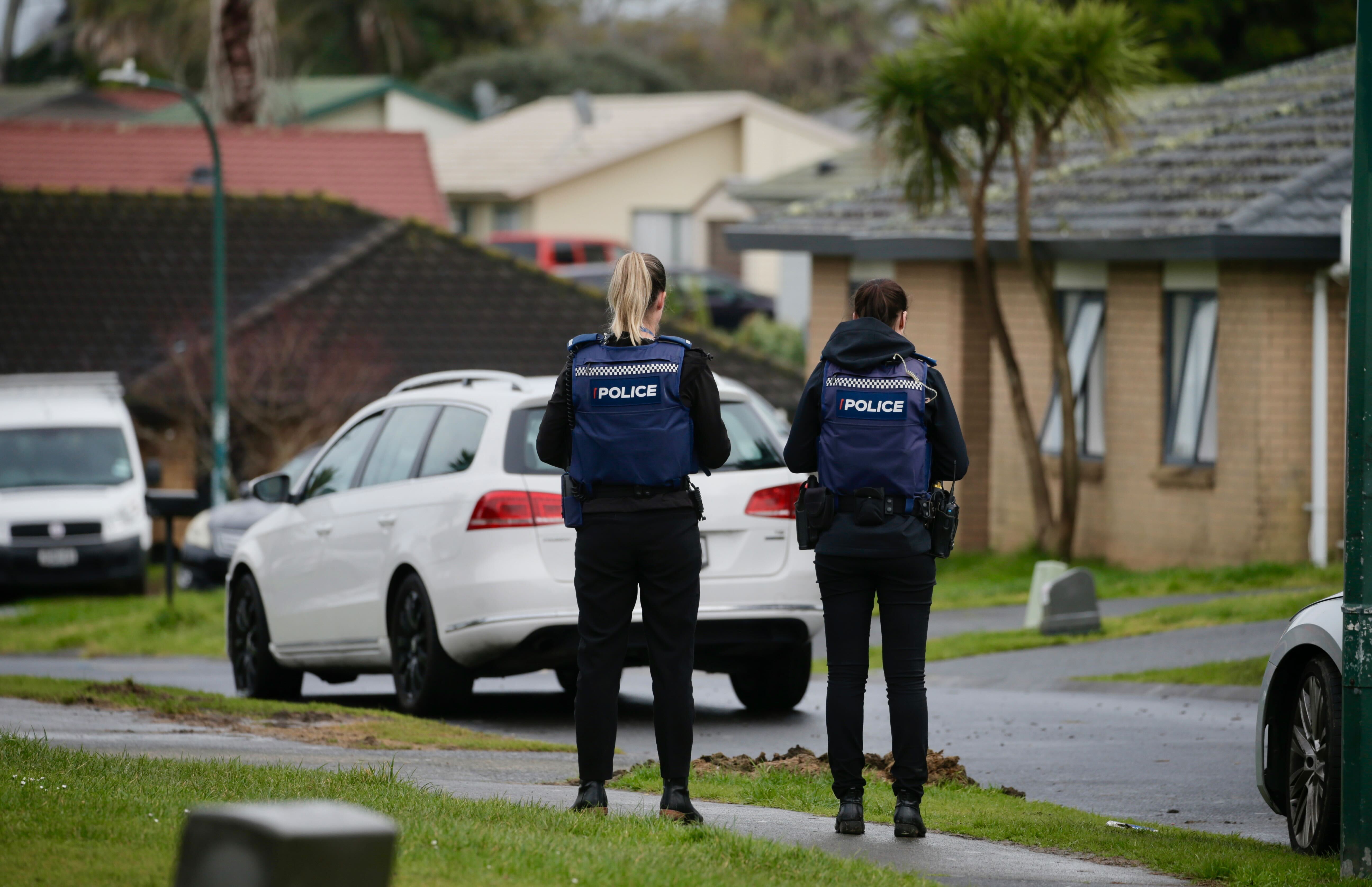 Police at Outrigger Place, Māngere in Auckland after gunshots were fired at a house overnight. Photo / Alex Burton