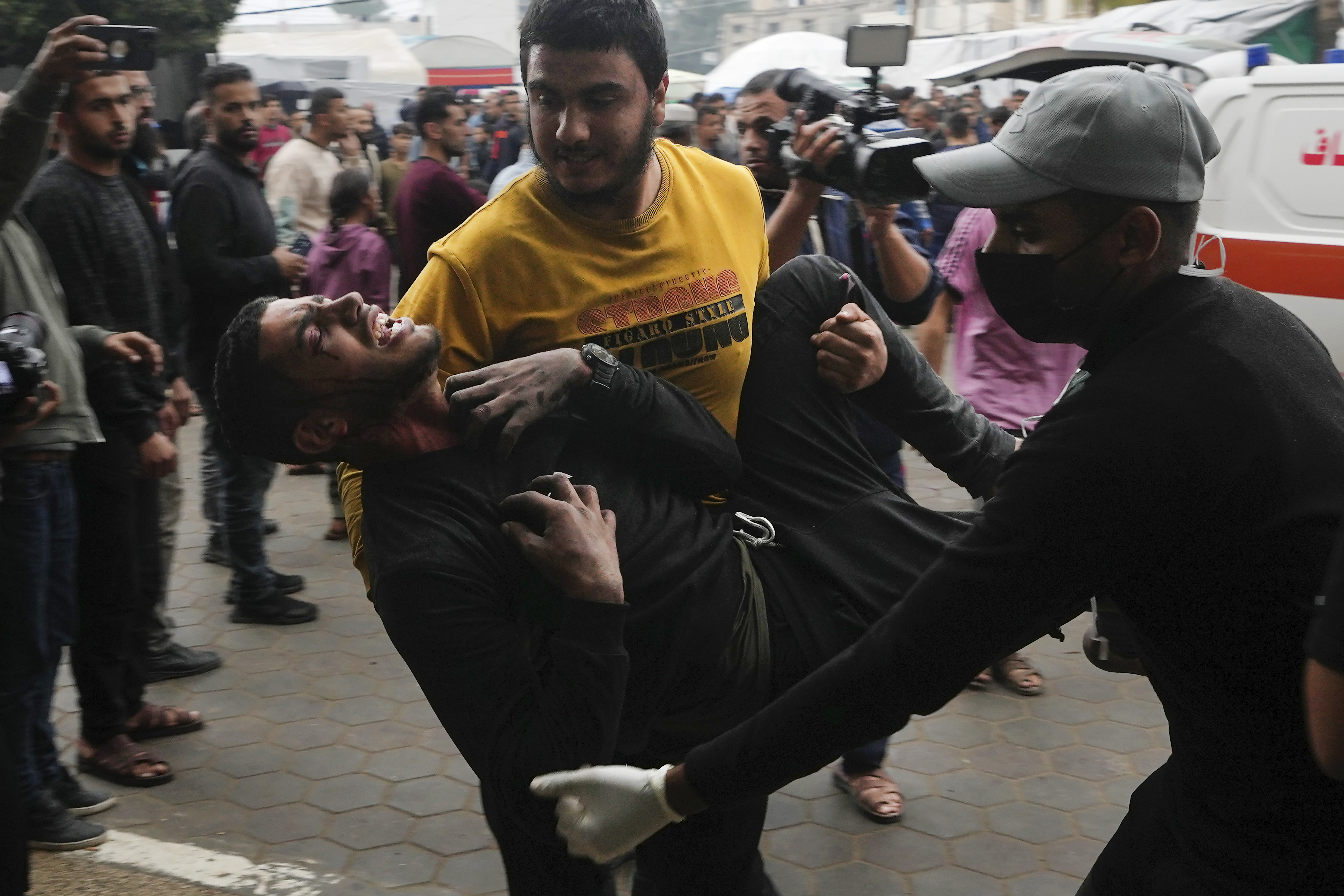 Palestinians wounded in the Israeli bombardment of the Gaza Strip are brought to the hospital in Deir al Balah. Photo / AP