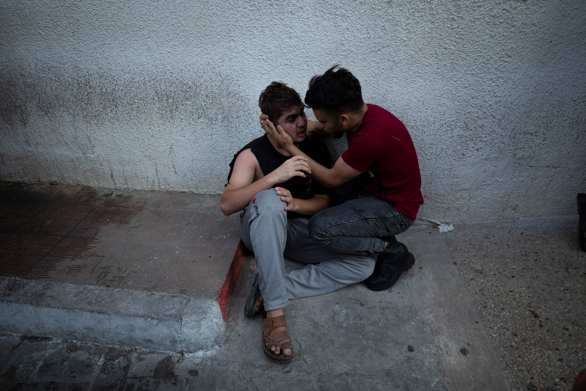 Palestinians wait outside a hospital in Gaza City. Photo / AP