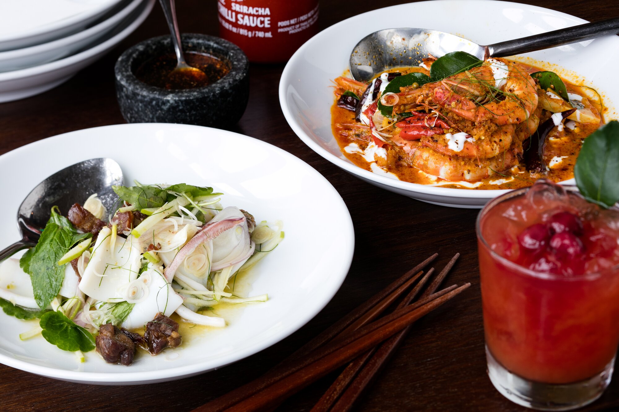 Moochowchow's yellow prawn curry and squid dish. Photo / Babiche Martens