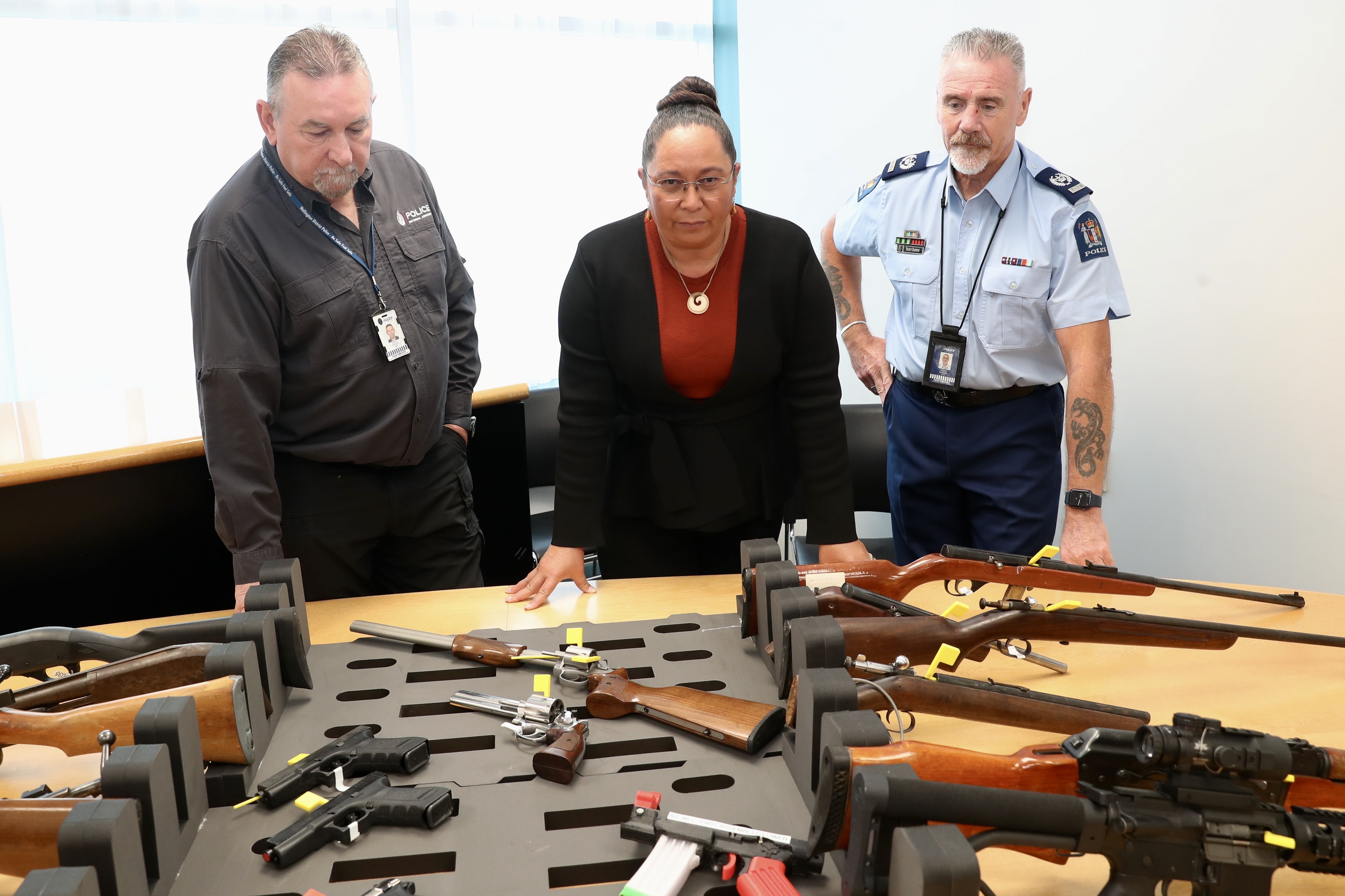 Associate Minister of Justice (Firearms) Nicole McKee with Senior Armourer Terry Quirke (left) and Senior Sergeant Paddy Hannon. Photo / Mark Mitchell