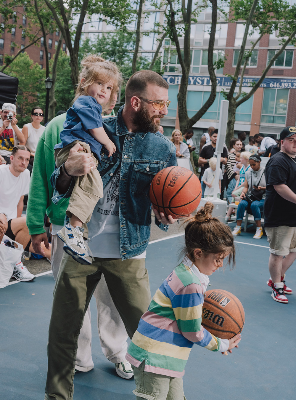 Santis with his daughter and a friend at an ALD and New Balance hosted basketball tournament earlier this year. Photo / Christopher Lee, The New York Times