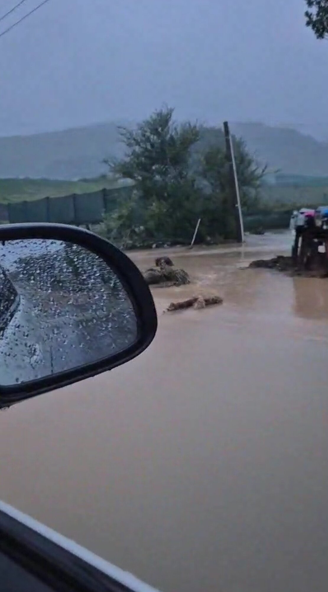 Pāpāmoa couple Zoe Beck and Lindsay Putt said the level of water on the road as they left their home was 