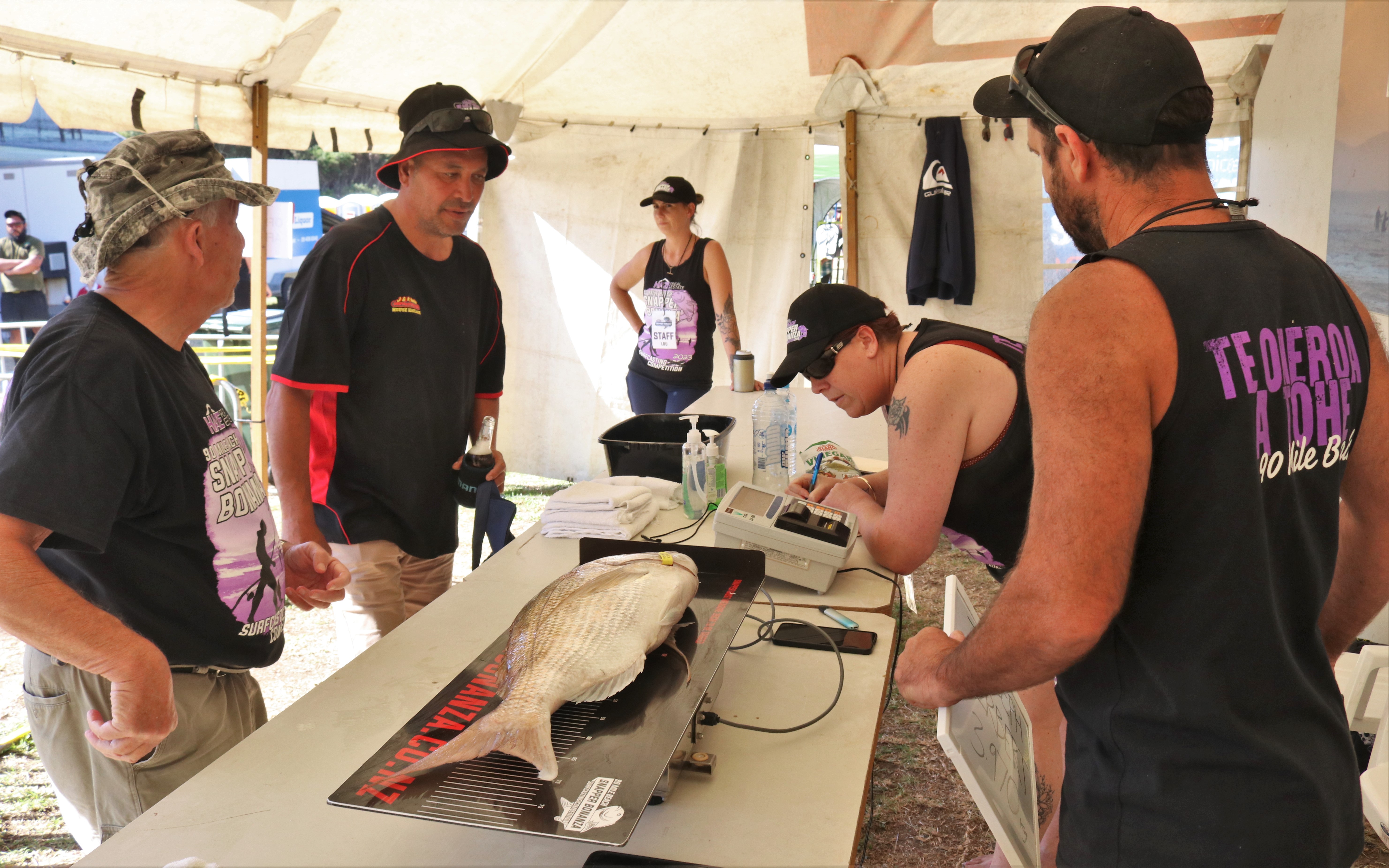 Dar Christensen, of Kaitāia, gets onto Saturday’s leaderboard with a 4.45kg fish. Photo / Peter de Graaf