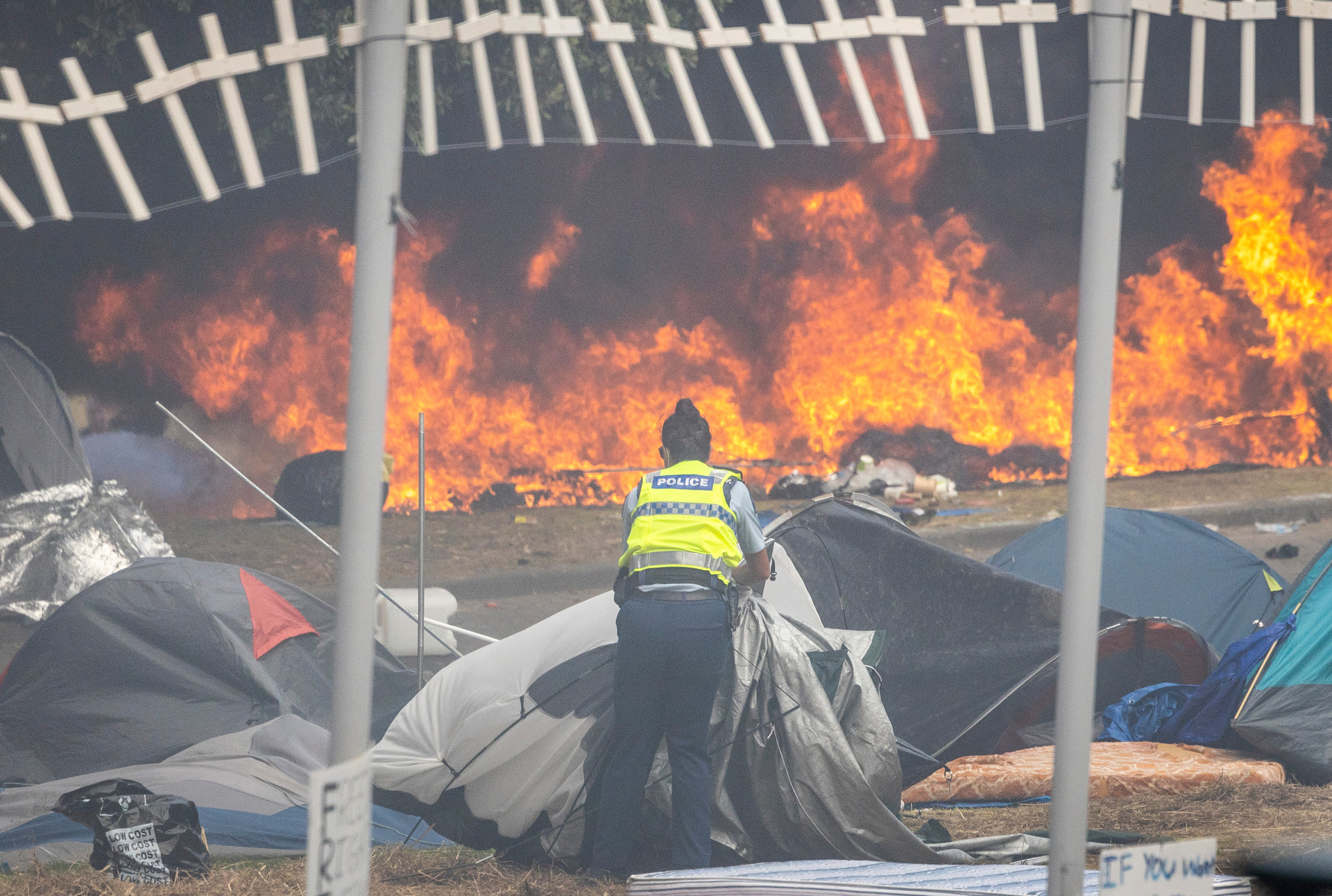 Police clearing Parliament grounds of protesters and tents this afternoon which was violent. Photo / Mike Scott 