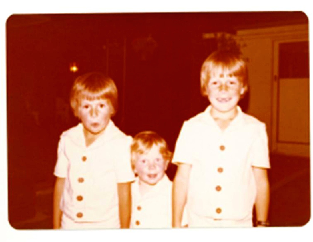 Memories: The Luxon brothers in 1977, from left, Karl, Matthew and Christopher, in safari suits made by their mother for their first flight from Auckland to Christchurch. Photo / Supplied