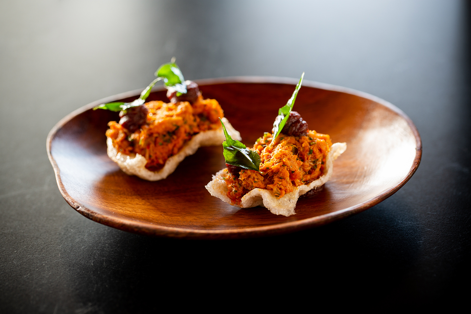 The pork chicharrones with nduja rillette and dates. Photo / Babiche Martens