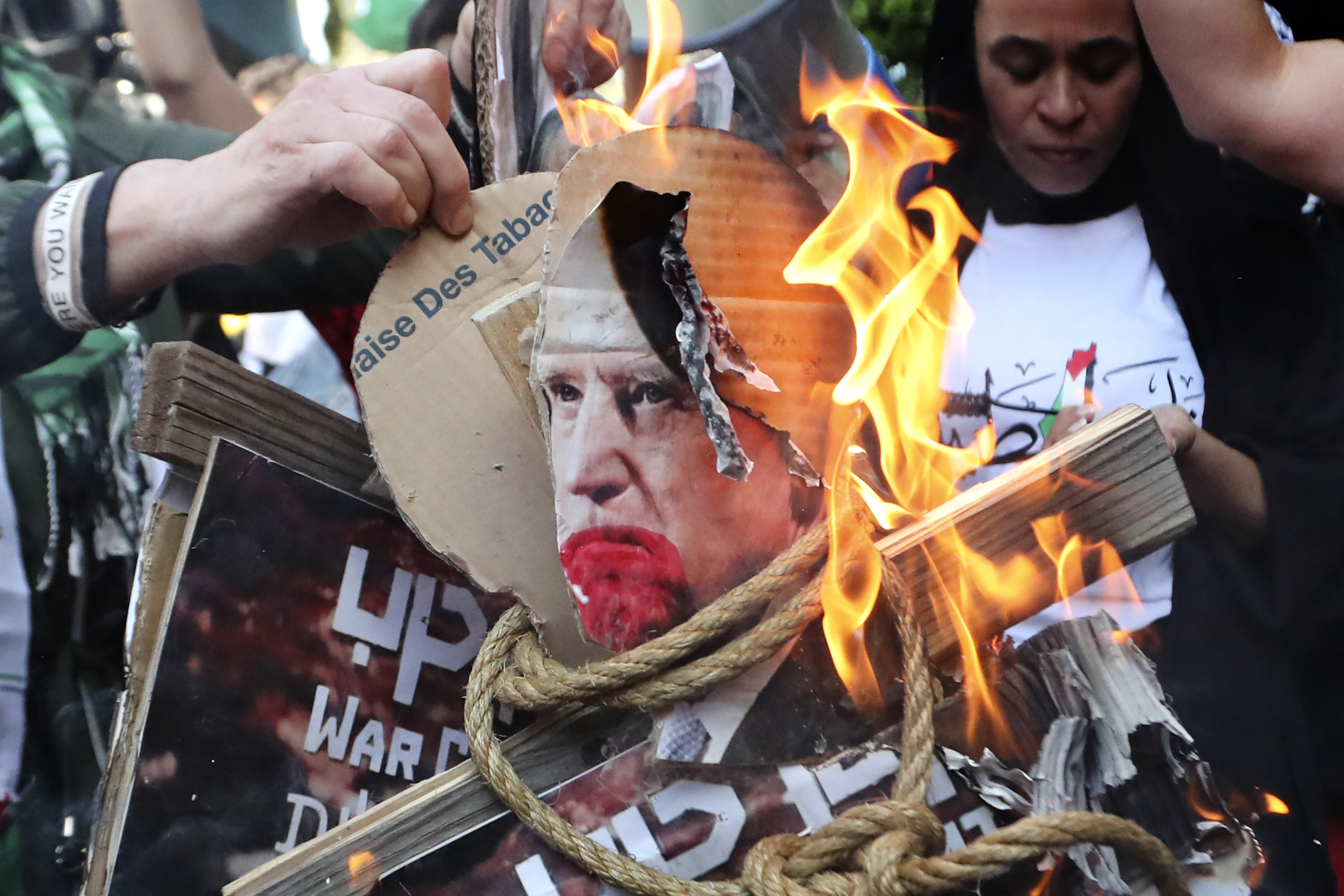 Palestinian protesters burn pictures that show US President Joe Biden at the Palestinian refugee camp of Ein el-Hilweh, south Lebanon. Photo / AP