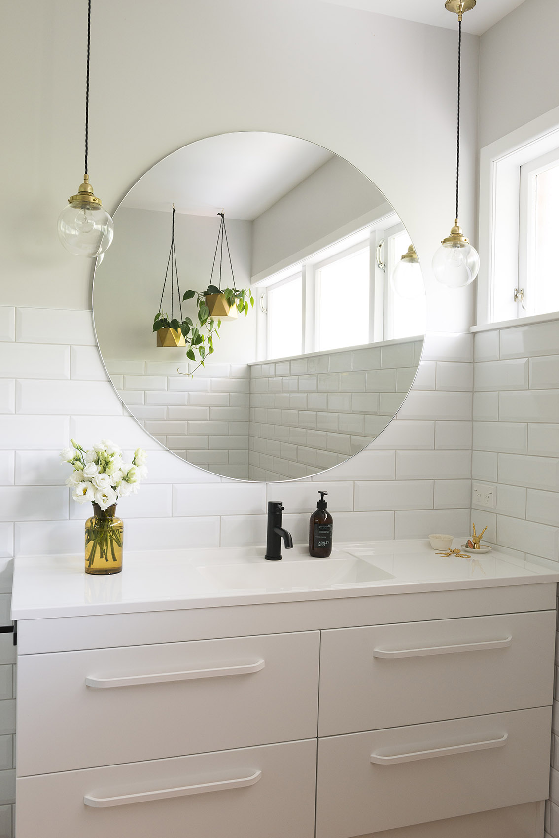 Lighting makes a statement above this vanity. Photo / Cave Bureau