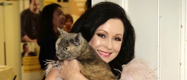 Cat Lady Anne Batley Burton and friend. Photo / Supplied