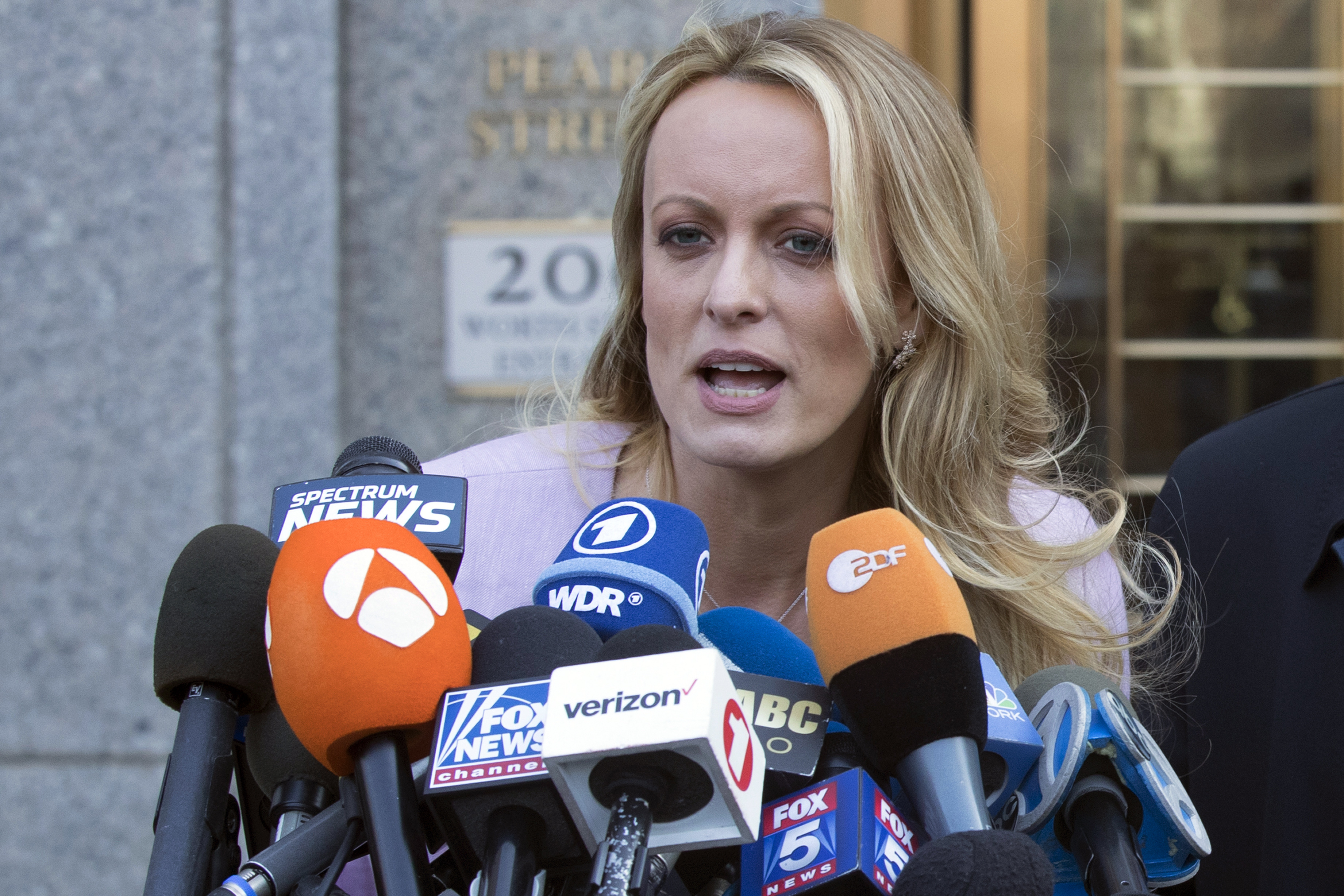Adult film actress Stormy Daniels speaks outside federal court. Photo / AP