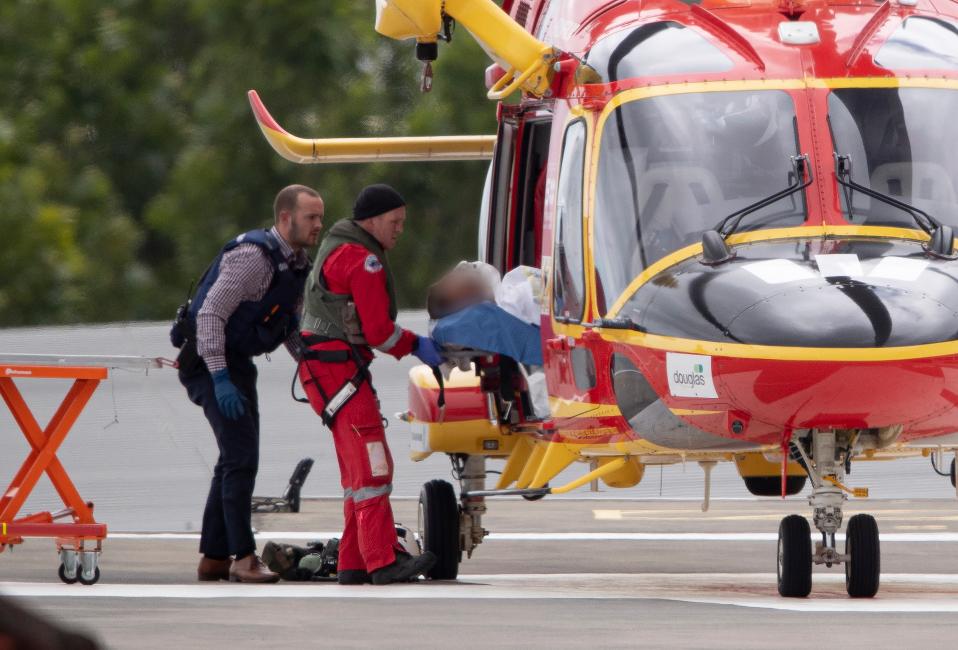 A rescue helicopter arrives at Auckland Hospital with a man shot by police during an incident where a police dog was also shot in Northland. Photo / Dean Purcell