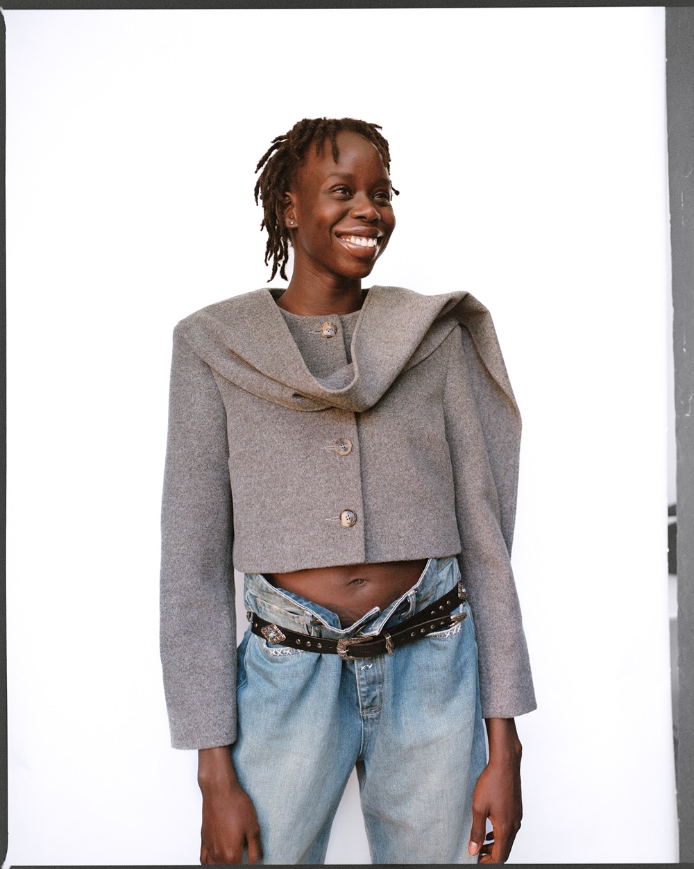 Ayan Makoii wears Florence & Fortitude jacket, Manaaki jeans and vintage belt. Photo / Rob Tennent