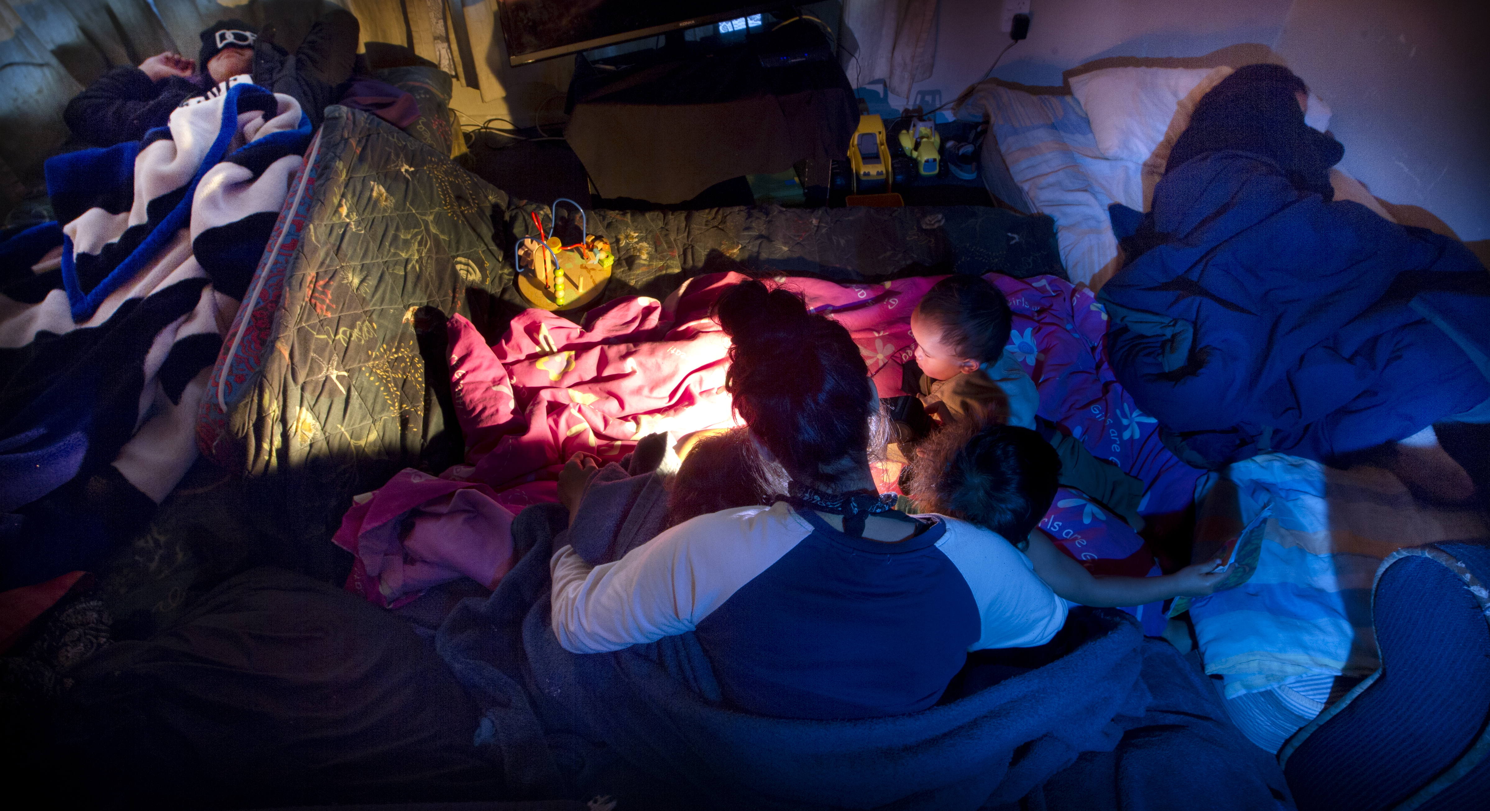 Families often sleep together for warmth in one room to avoid heating the whole house. Photo / Stephen Parker
