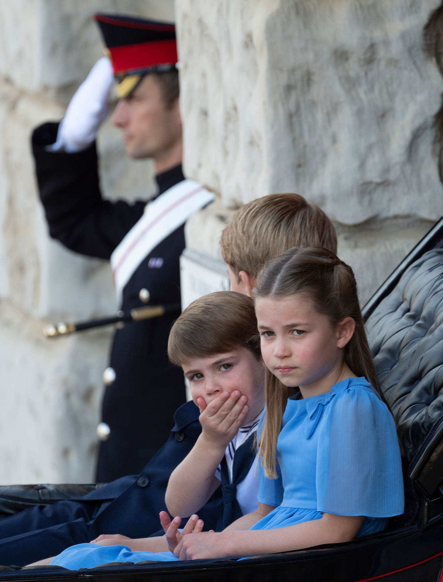 Princess Charlotte, Prince Louis and Prince George ride in a carriage as they make their way to the Trooping the Colour, in London. Photo / AP