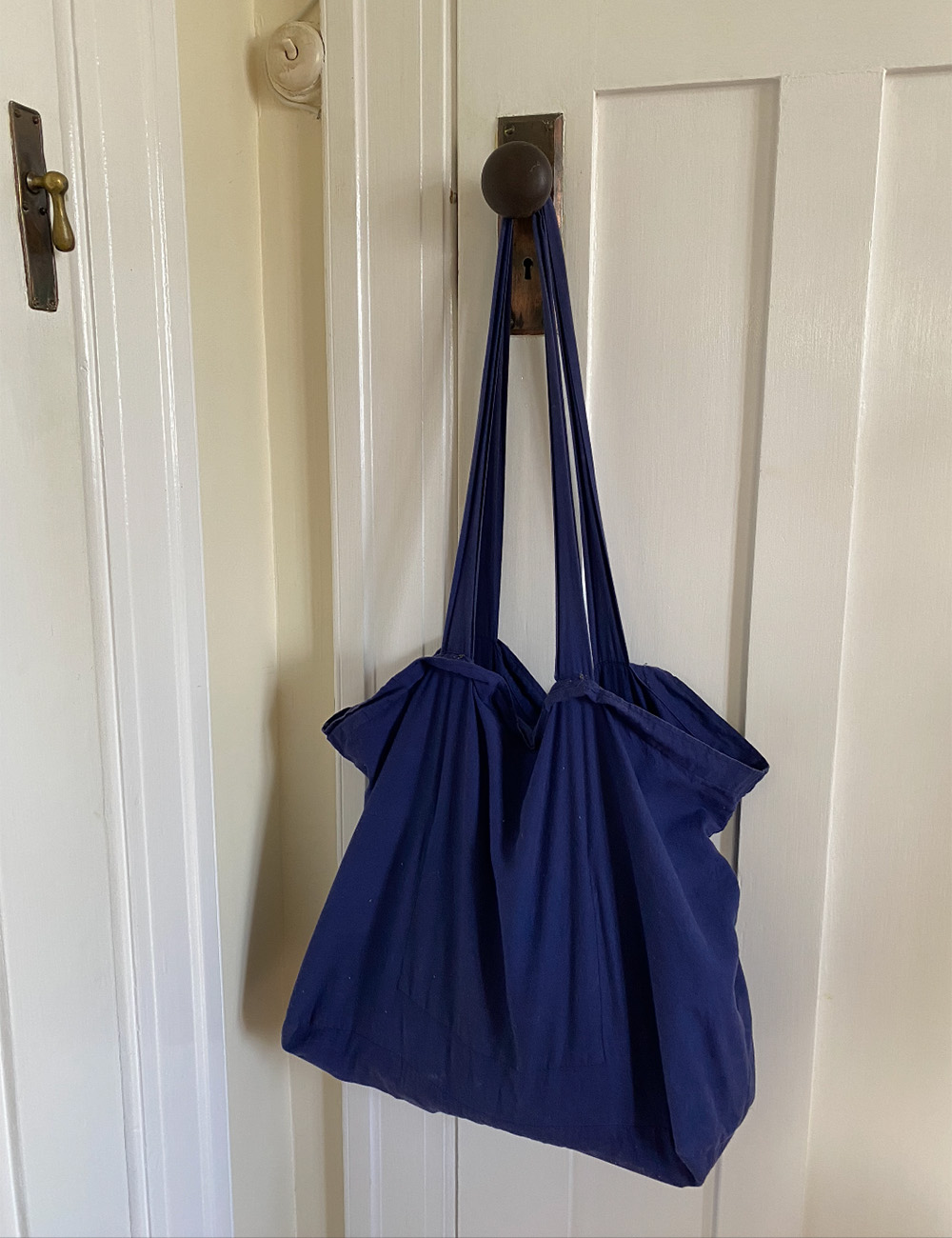 A simple blue tote makes Amanda Jane Robinson's day breezy.