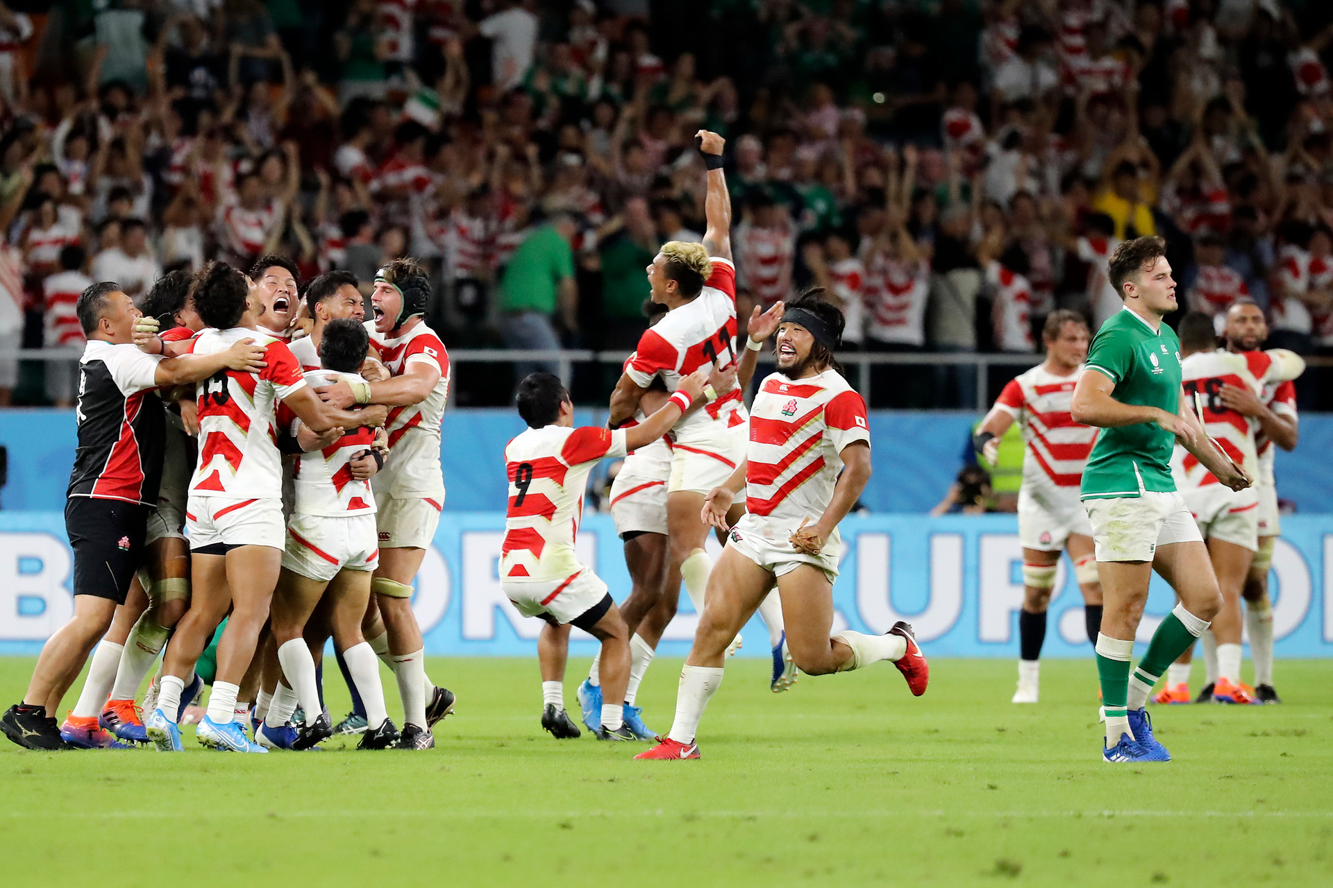 Japan's players celebrate after defeating Ireland 19-12 in their Rugby World Cup Pool A game at Shizuoka Stadium Ecopa against Ireland in Shizuoka, Japan. Photo / AP