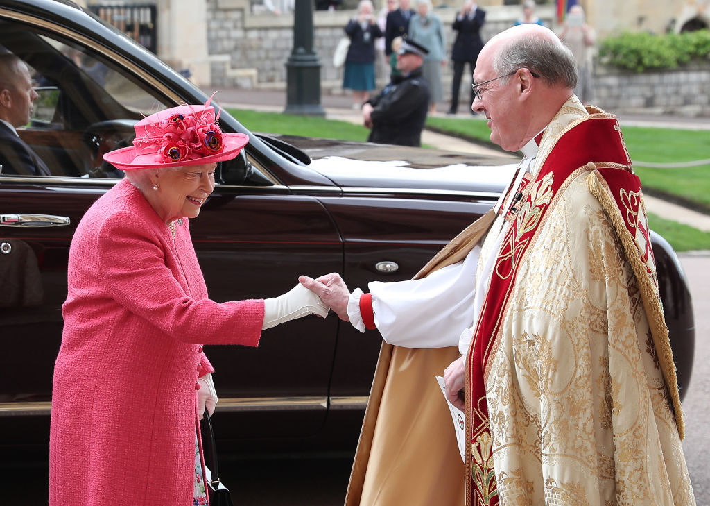 The monarch wore a pink A-line coat, and a lilac and pink silk dress by Stewart Parvin. Photo / Getty Images