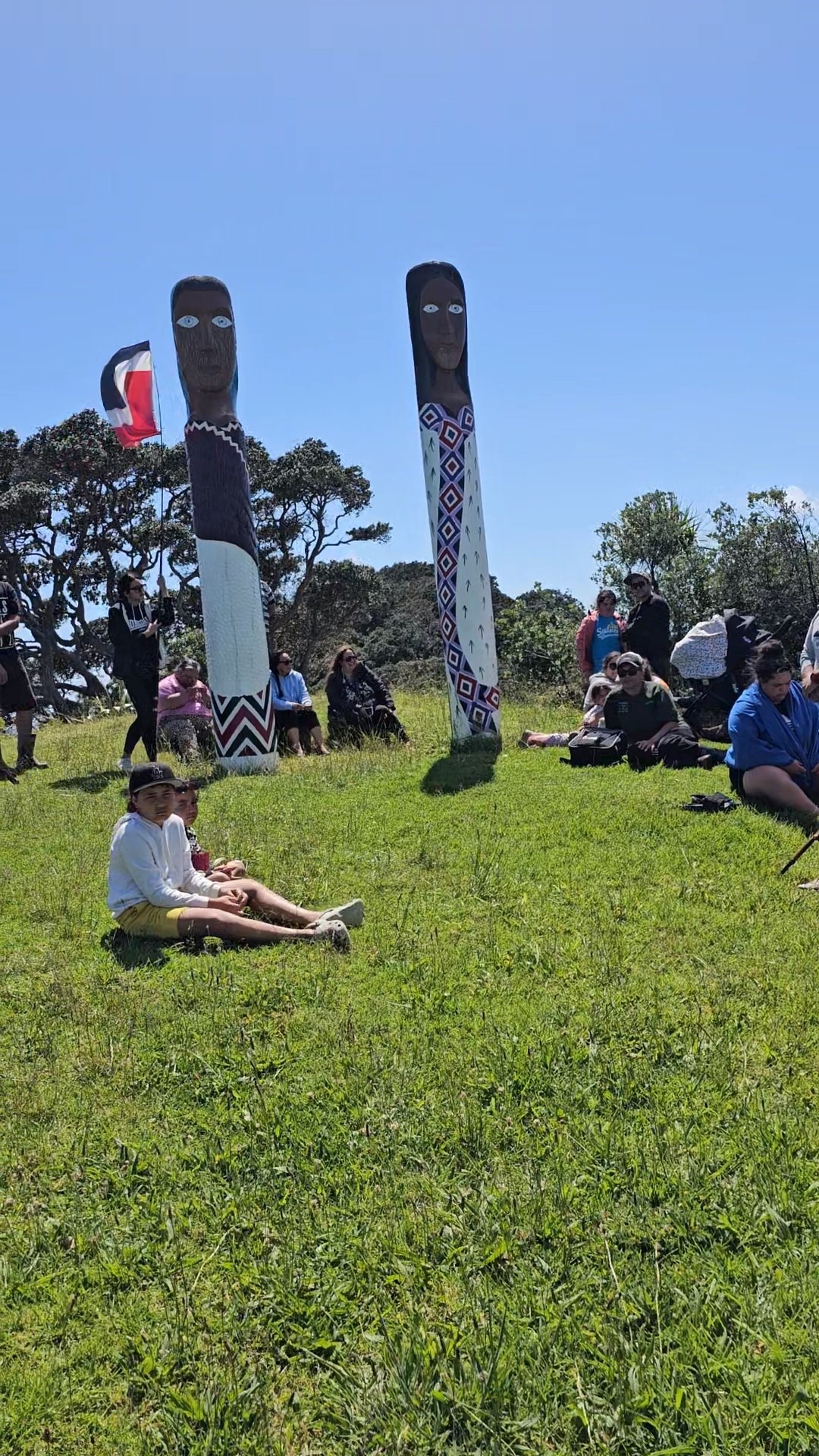 Two pou watch on as the karakia is carried out before a kina cull at Maitai Bay in the Far North last Saturday.