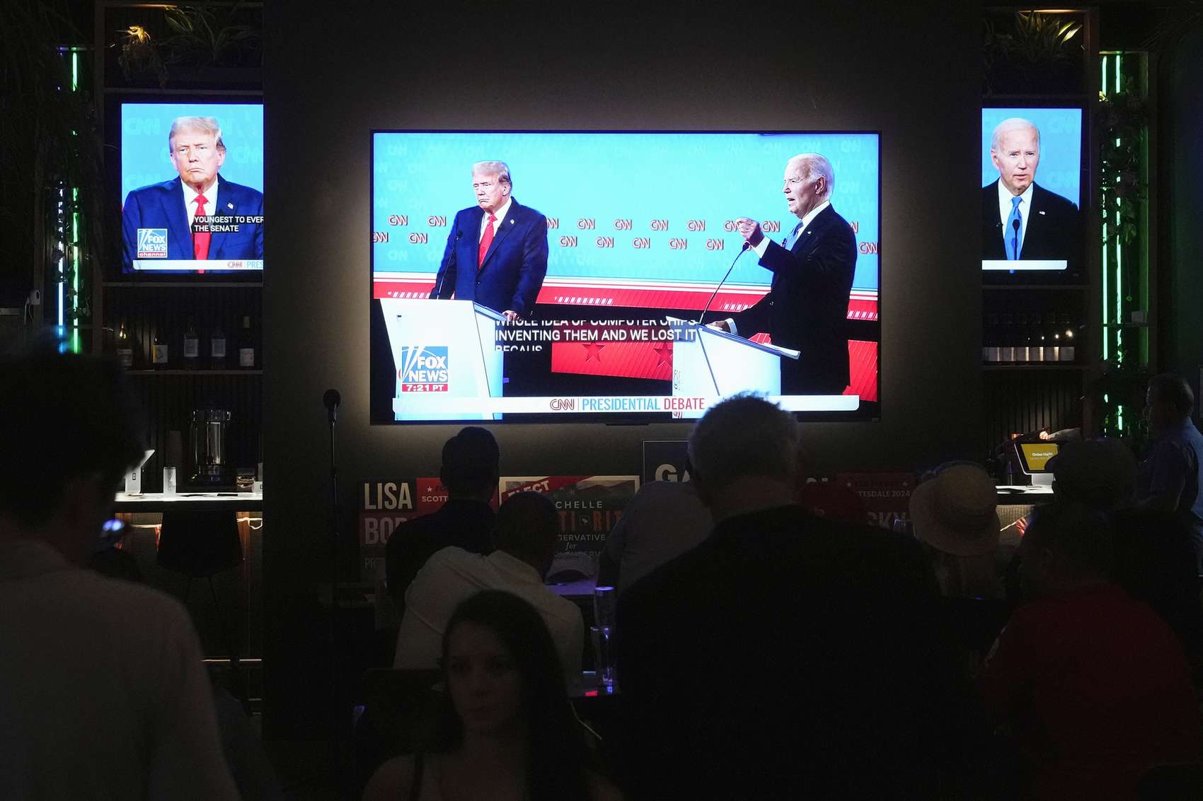 Patrons watch Joe Biden's debate with Donald Trump. Photo / AP