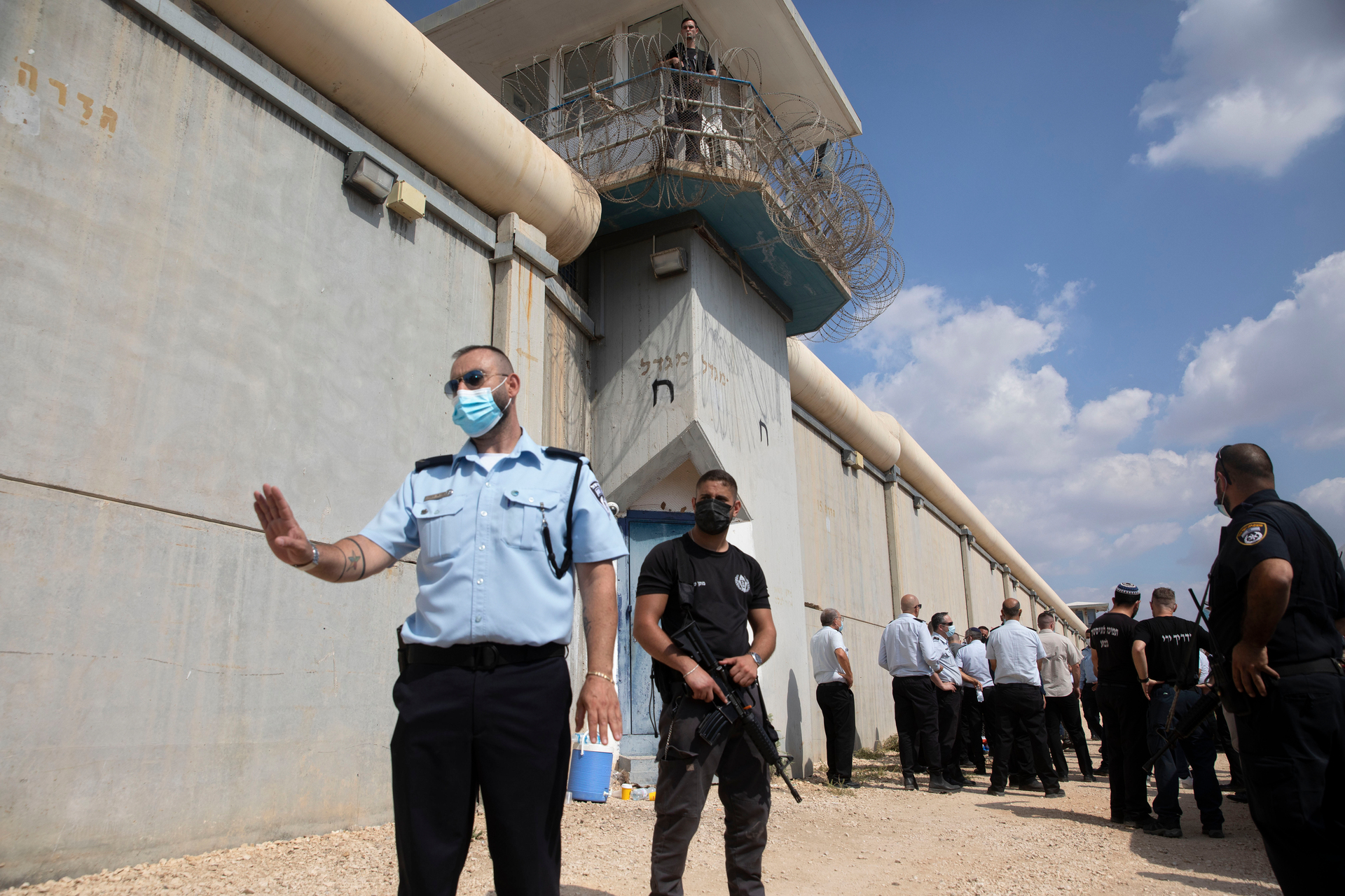 Police officers and prison guards inspect the scene of a prison escape outside the Gilboa prison in northern Israel yesterday. Photo / AP