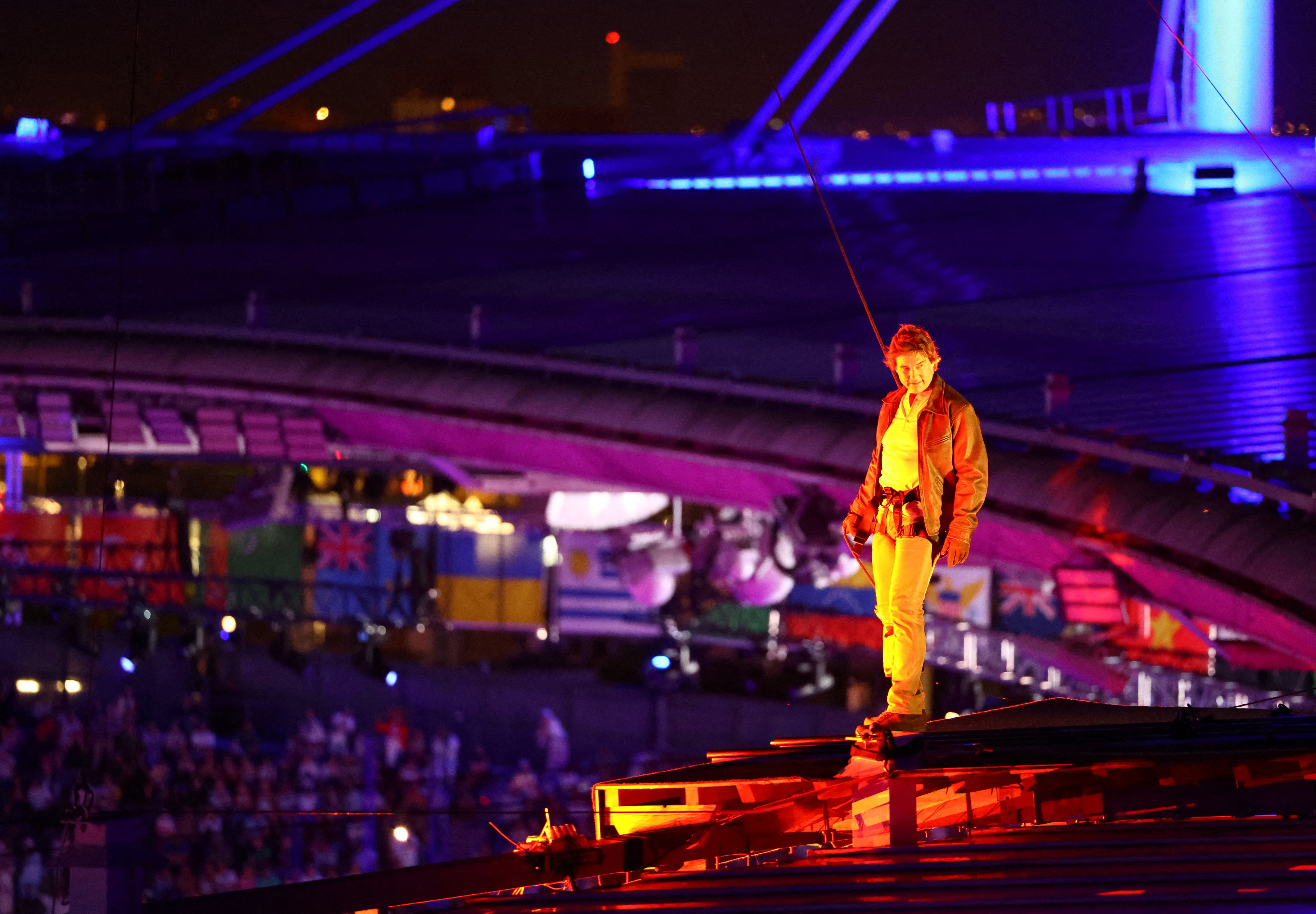 Tom Cruise began his turn atop the roof of the Stade de France. Photo / Getty Images