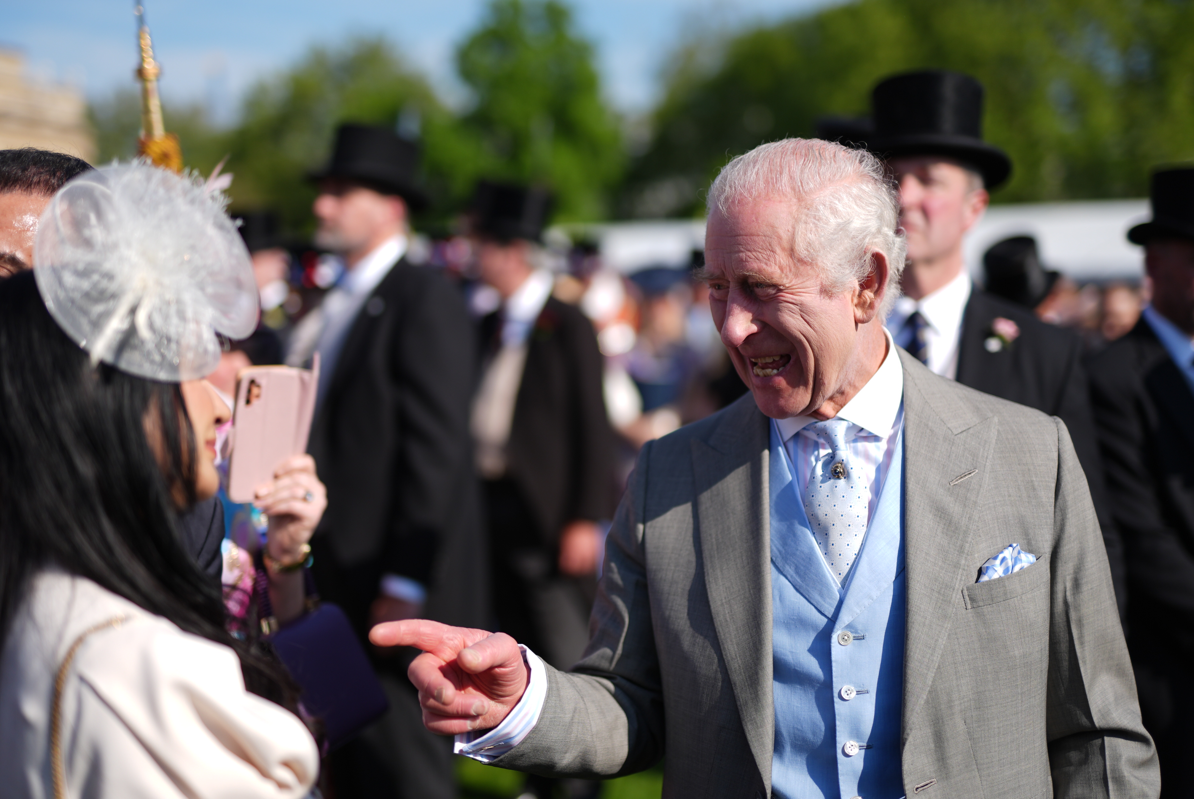 King Charles in good spirits as he speaks to guests. Photo / Getty Images