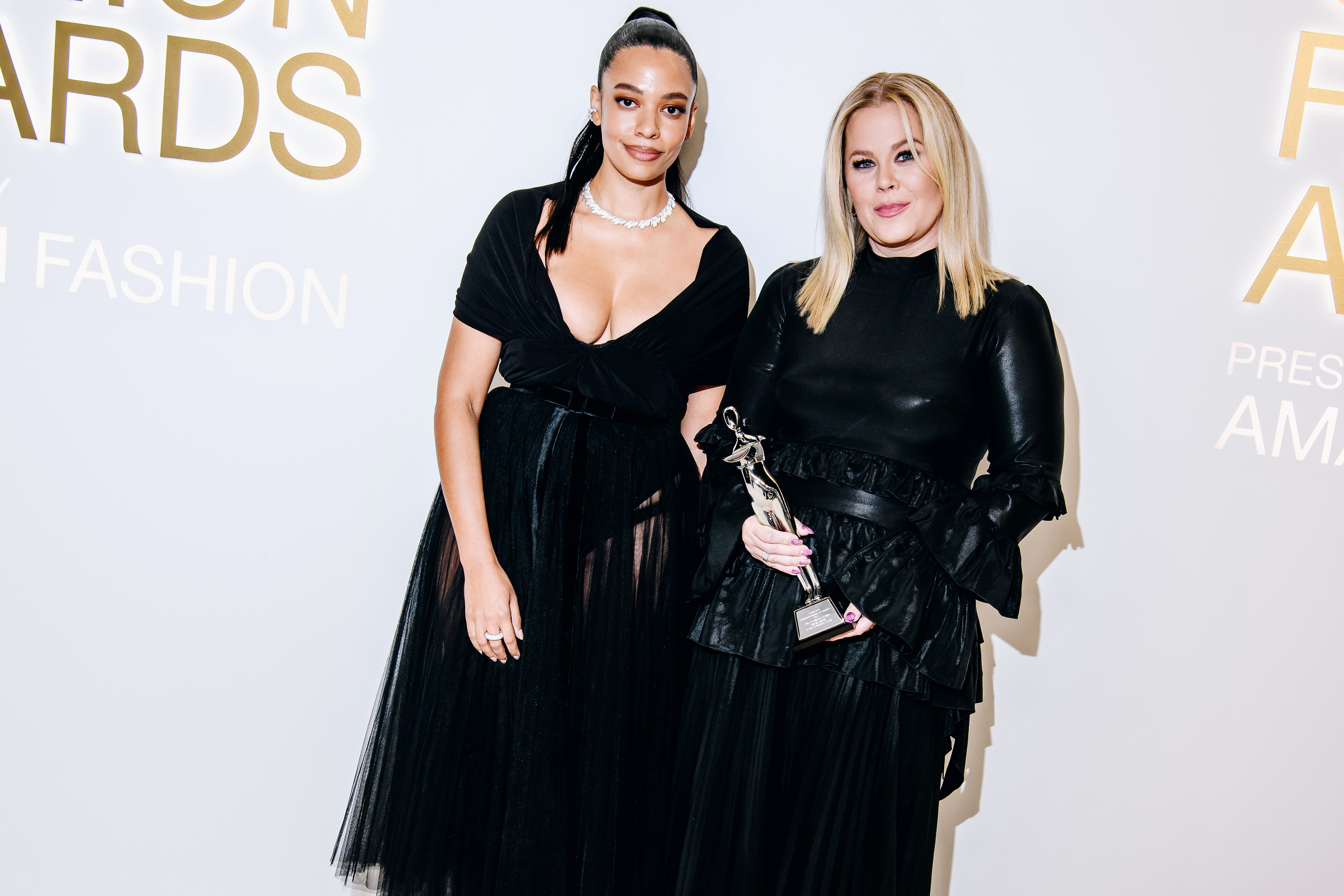 The designer Aurora James, left, with Shannon Abloh, the widow of Virgil Abloh, holding his posthumous Board of Trustees award, at the 67th annual Council of Fashion Designers of America Awards in New York, Nov. 7, 2022. Photo / Nina Westervelt, The New York Times
