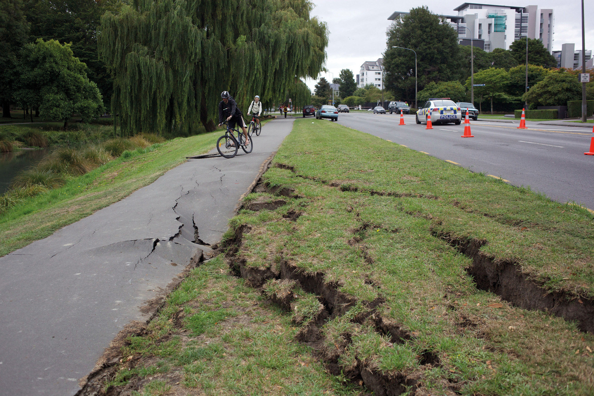 Cracks in a grass verge and cycle path following the powerful 2011 Christchurch quake. Photo / Tim Clayton