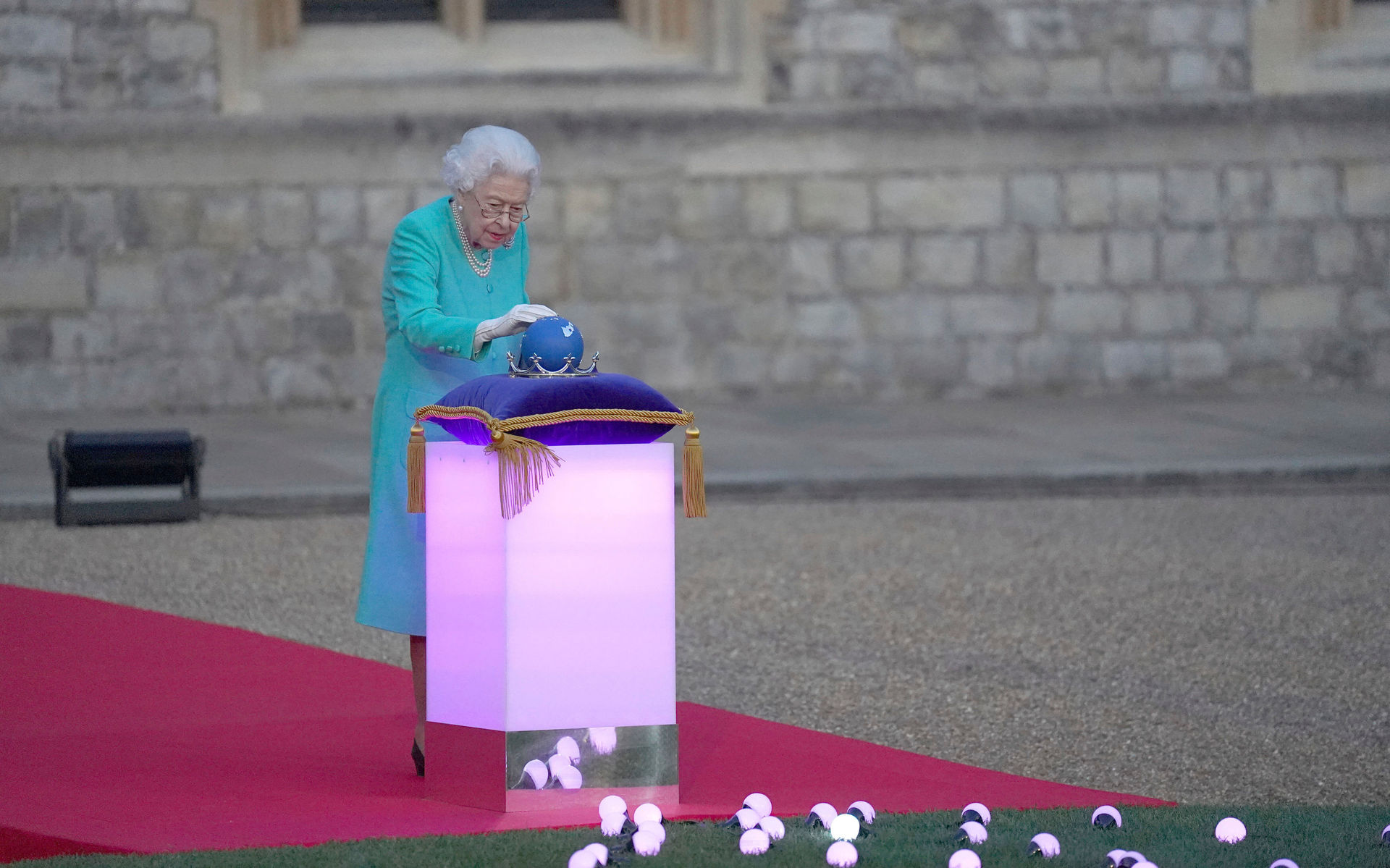Queen Elizabeth II symbolically leads the lighting of the principal Jubilee beacon at Windsor Castle. Photo / AP
