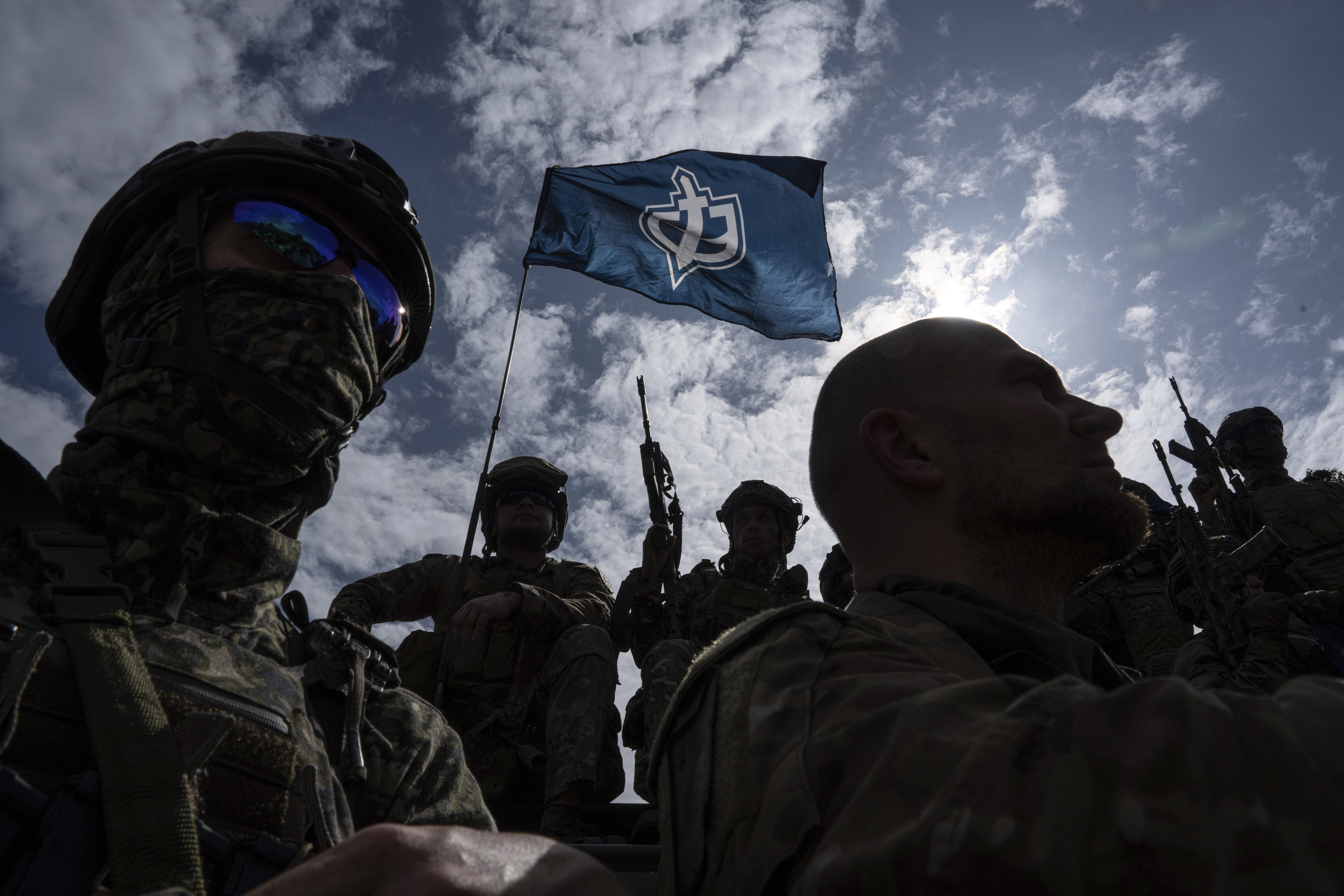 Russian Volunteer Corps fighters stand atop an APC during a press conference not far from Ukraine's border with Russia in the Sumy region, Ukraine. Photo / AP