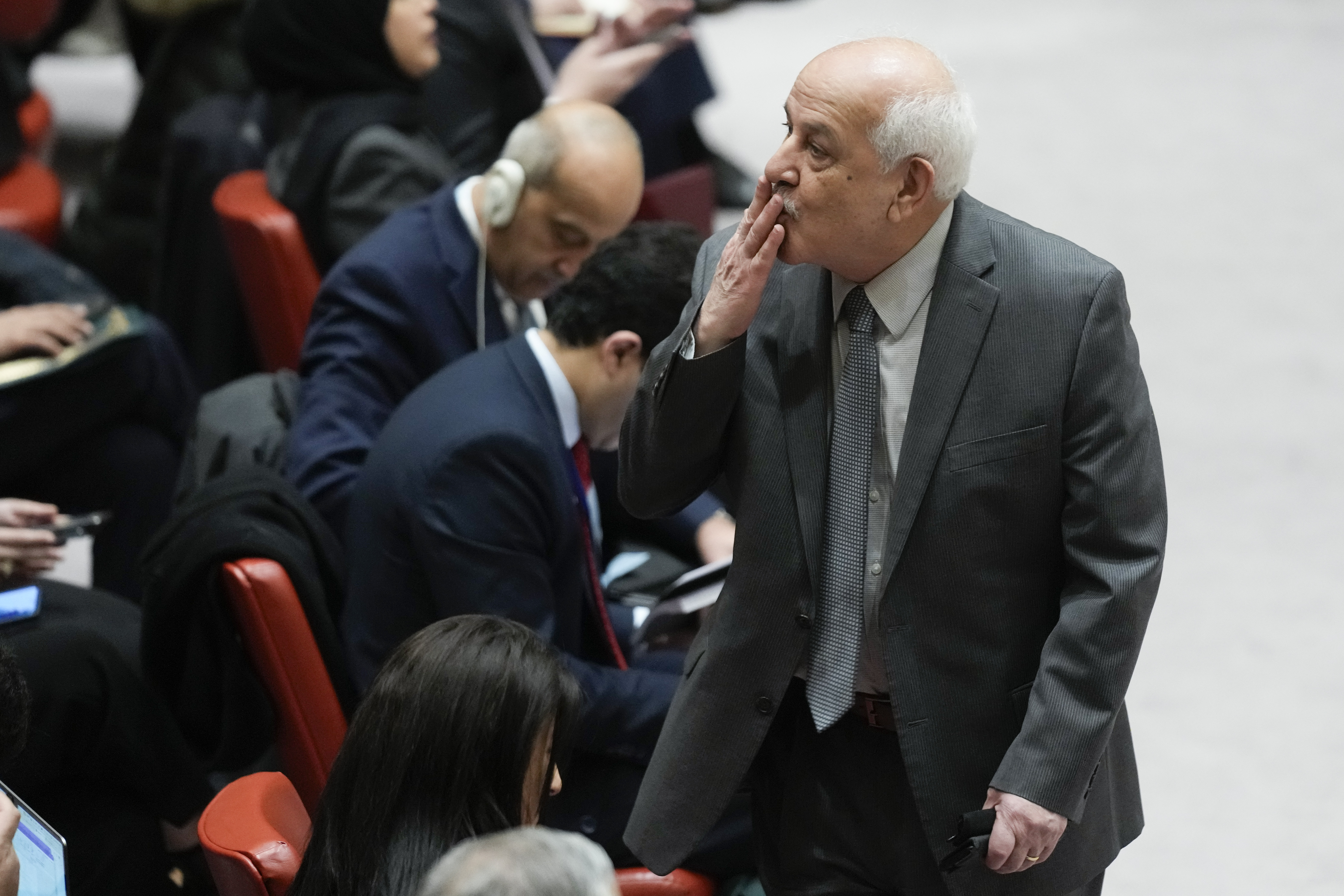Riyad Mansour, Palestinian Ambassador to the United Nations, blows a kiss to someone before the start of a Security Council meeting at United Nations headquarters. Photo / AP