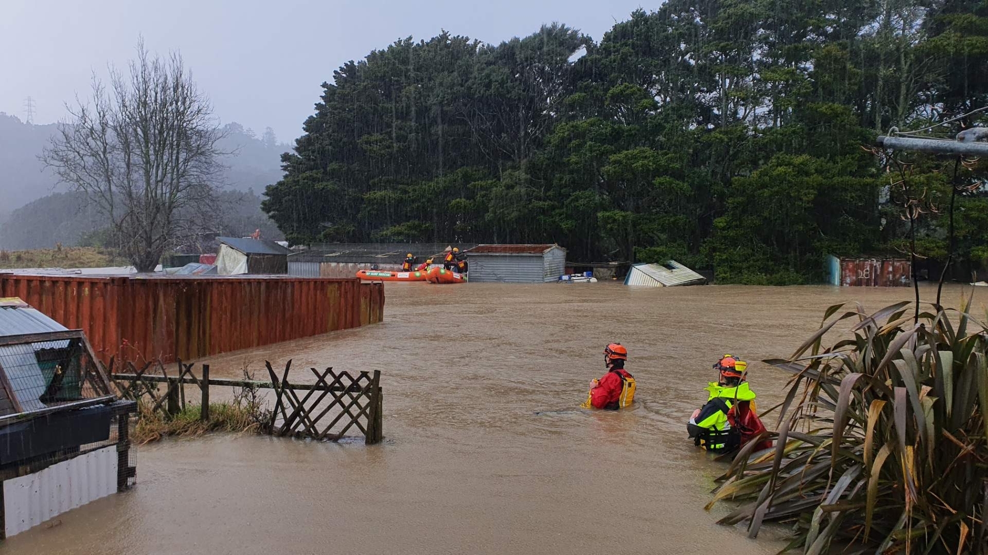 Earlier today lifesavers braved chest-high water to rescue a man trapped in his shed by the floodwaters in Tapu Rd.