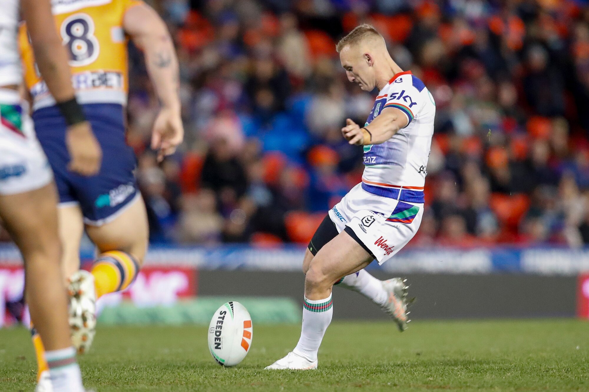 Warriors playmaker Tanah Boyd attempts a drop goal against the Knights. Photo / Photosport