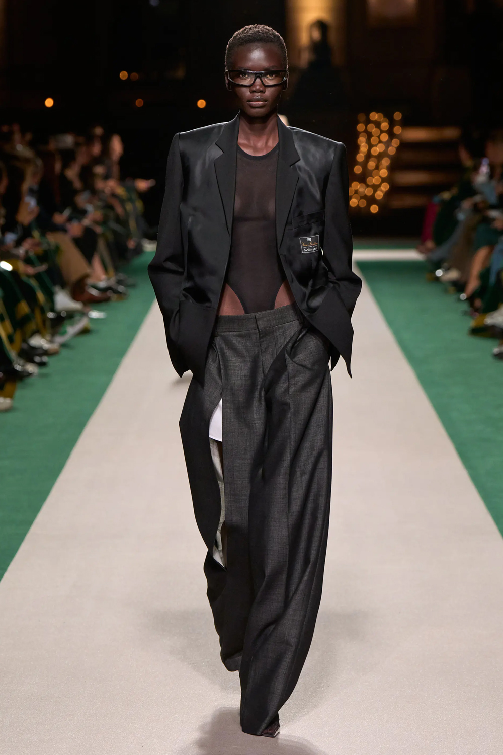 High-cut bodysuits were paired with ultra-low-slung tailored trousers.