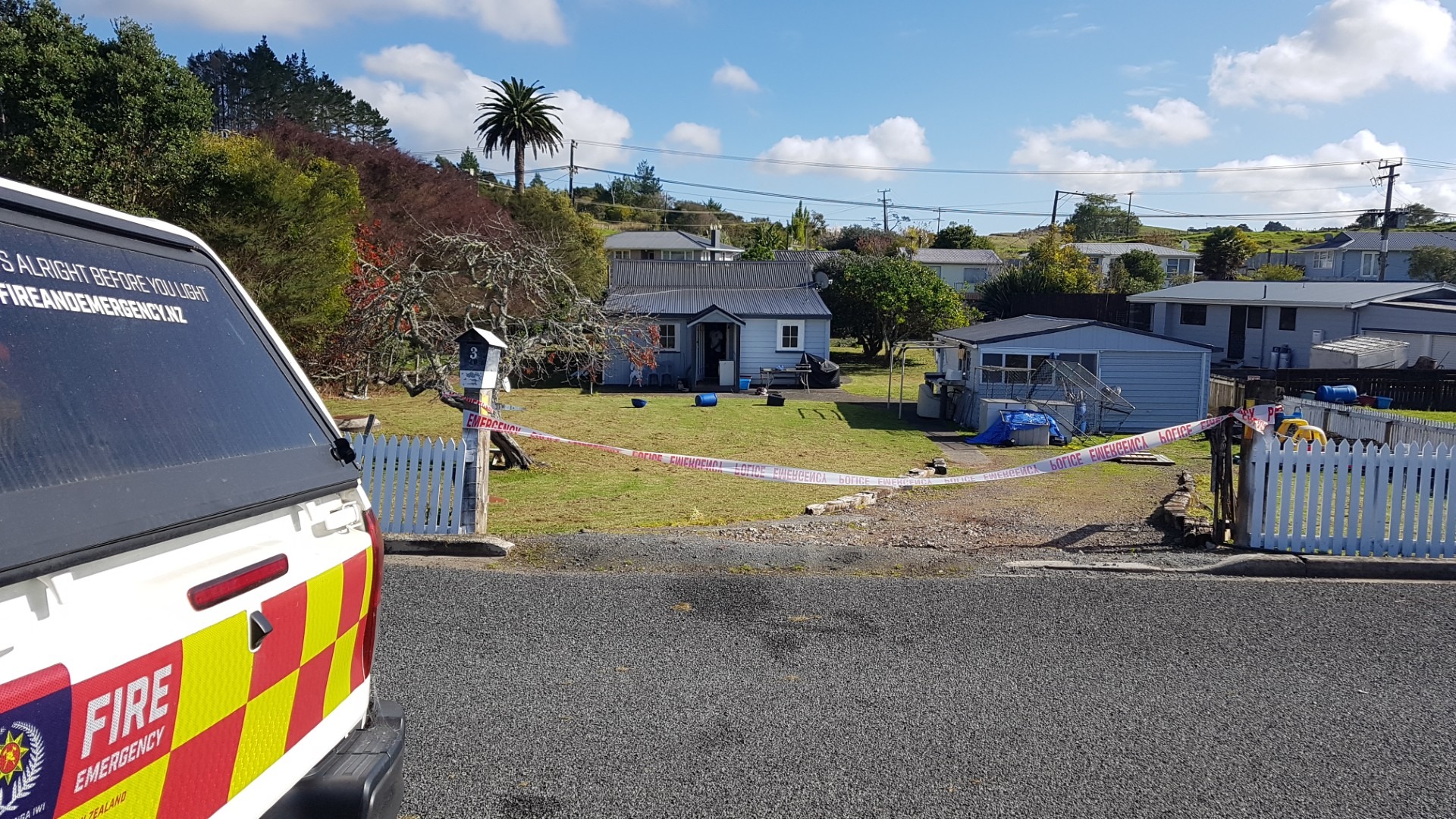 A fire safety investigator and a police were at the scene of a Hikurangi house fire on Sunday.