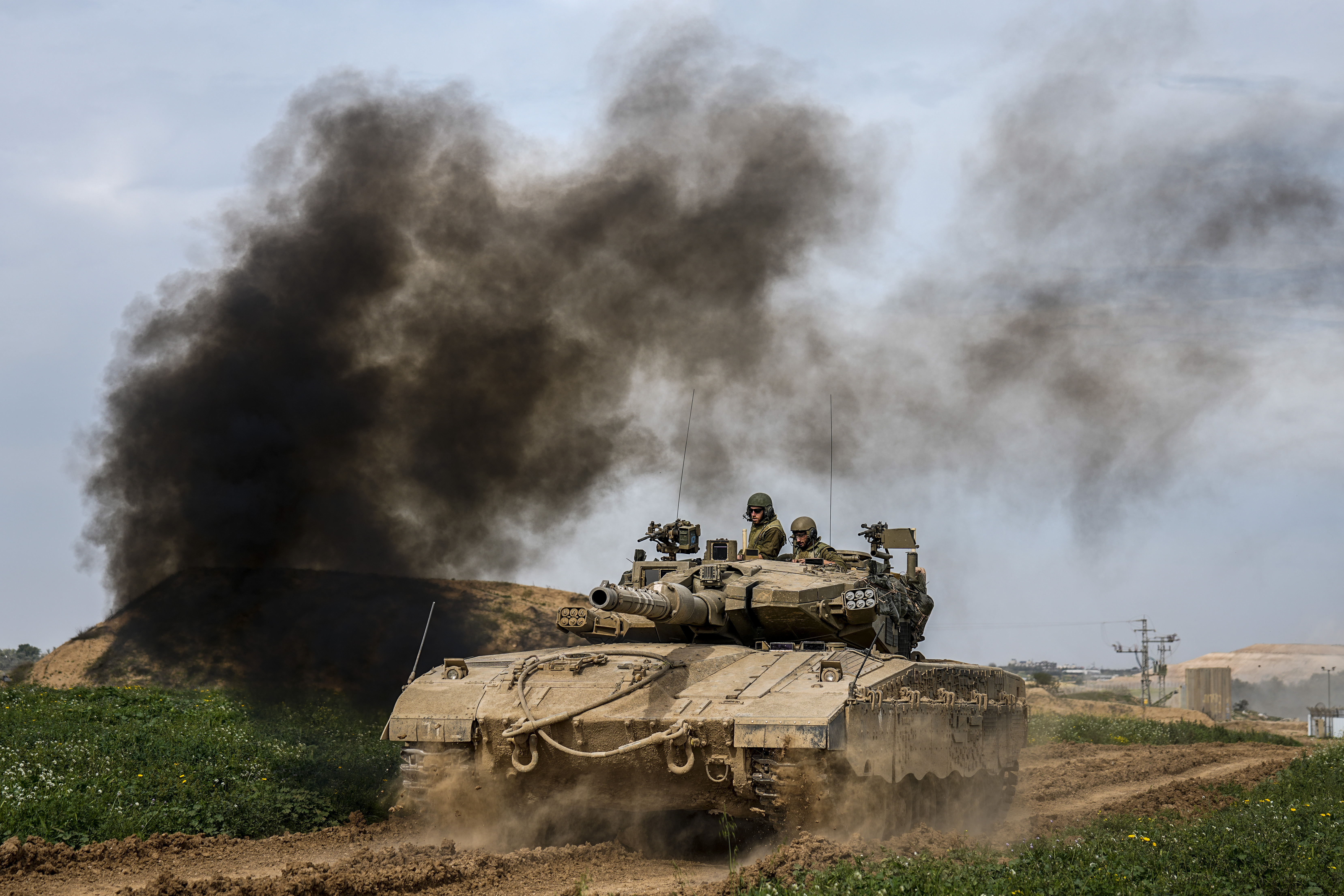 An Israeli tank patrols the border with the Gaza Strip in southern Israel. Photo / AP