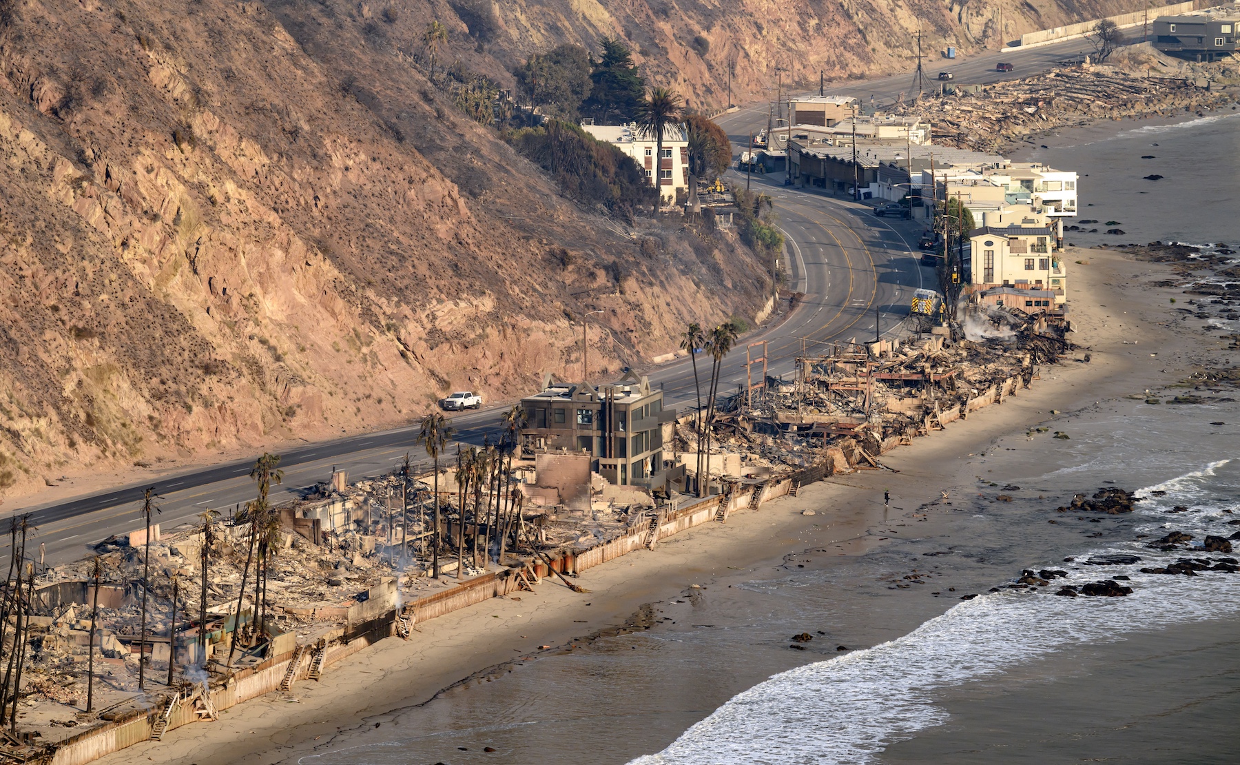 Burned homes are seen during the Palisades fire in the Malibu area of Los Angeles county, California. Photo / AFP