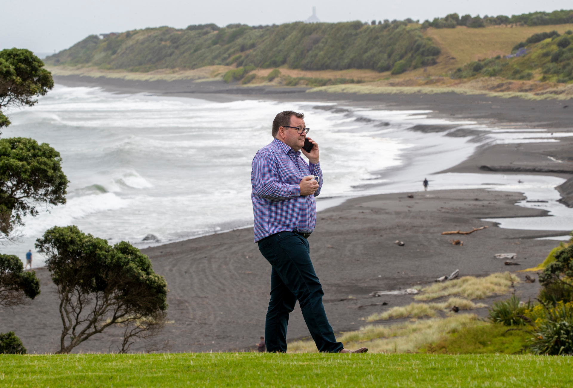Work continues for Finance Minister Grant Robertson during the morning tea break at their Away Caucus at the Bungalow Coastal Retreat near New Plymouth. Photo / Mark Mitchell