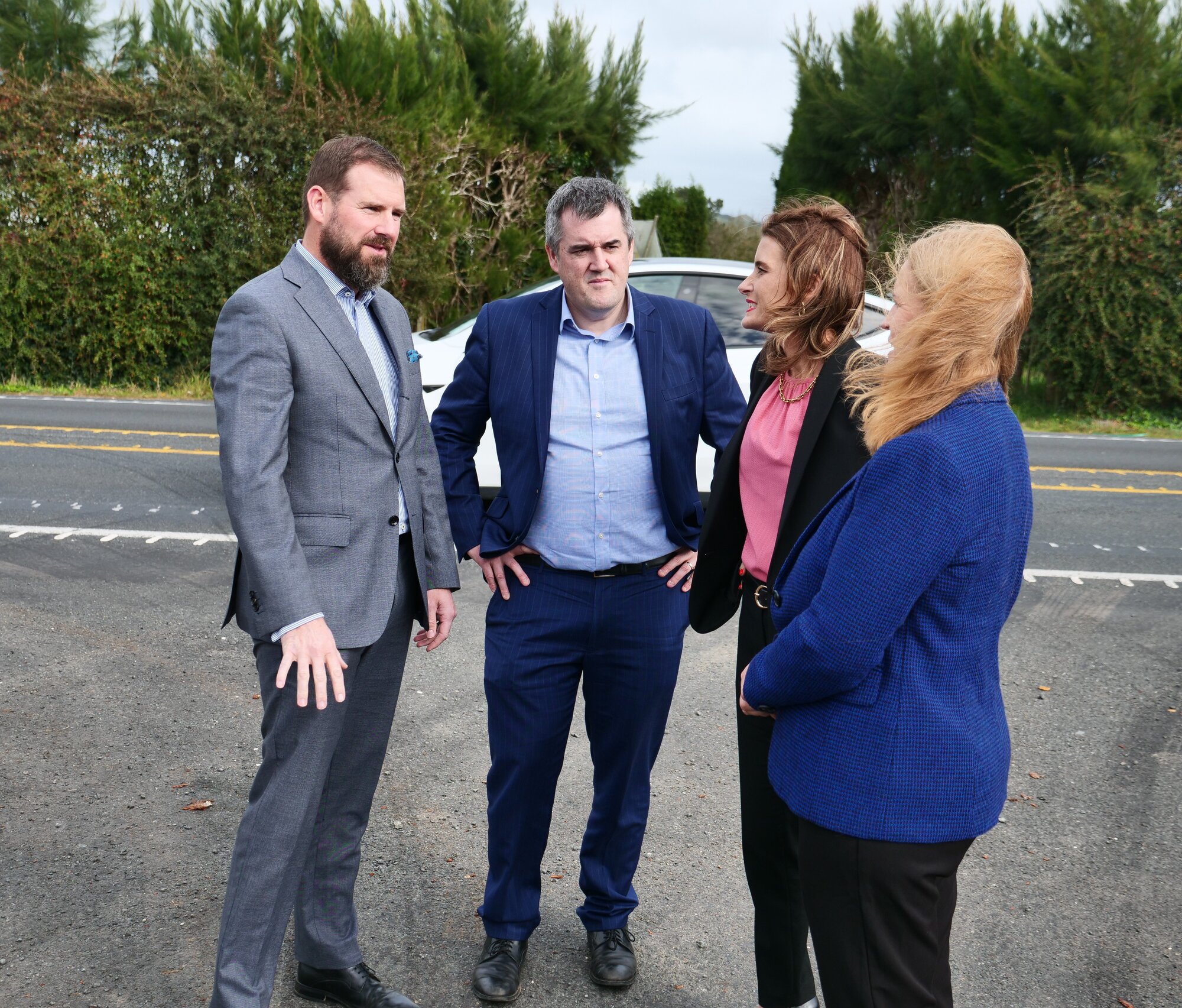 Waikato MP Tim van de Molen (from left), Transport Minister Chris Bishop, Finance Minister Nicola Willis and Taupō MP Louise Upston at the Cambridge to Piarere Road of National Significance site near Karāpiro on Sunday. Photo / Tom Eley
