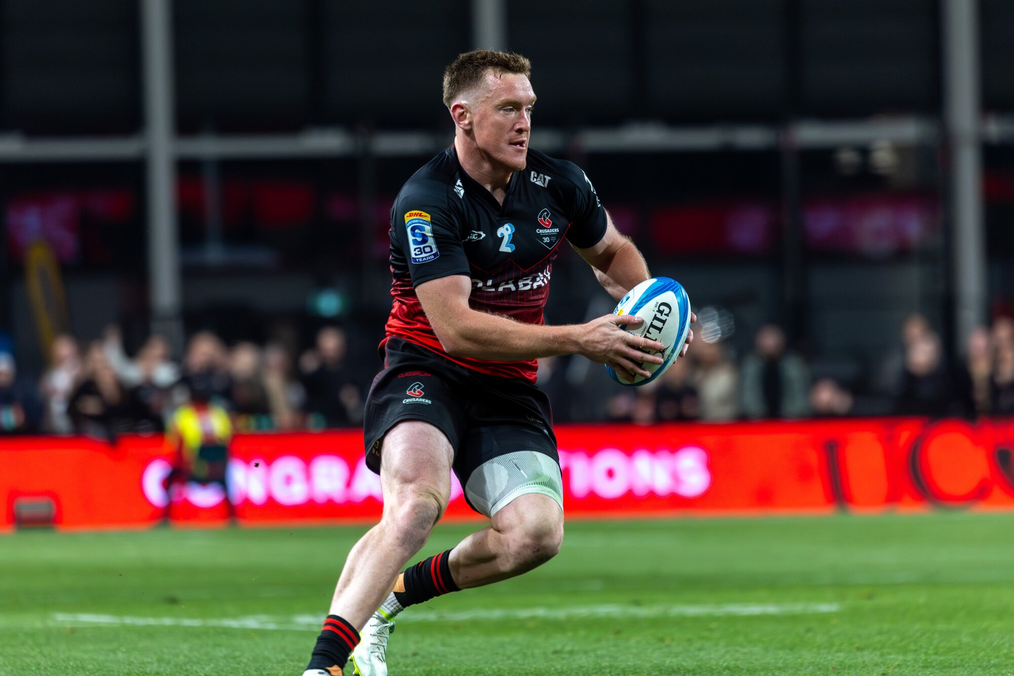 Crusaders winger Dallas Mcleod makes a break against the Waratahs. Photo / Alyse Wright 