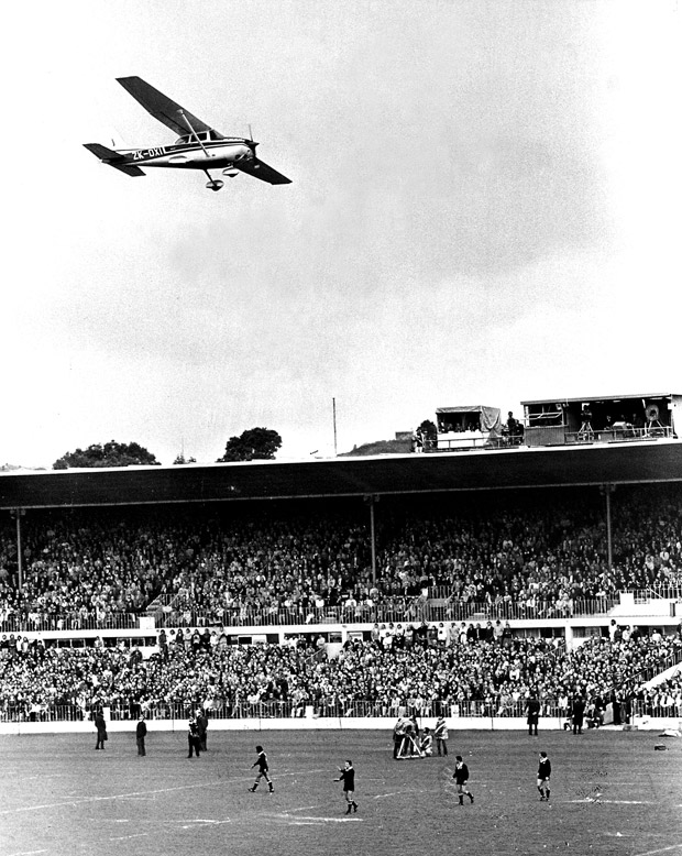 Marx Jones flies a Cessna  low over the All Blacks v Springboks final test match at Eden Park, dropping flour bombs. Photo / NZ Herald